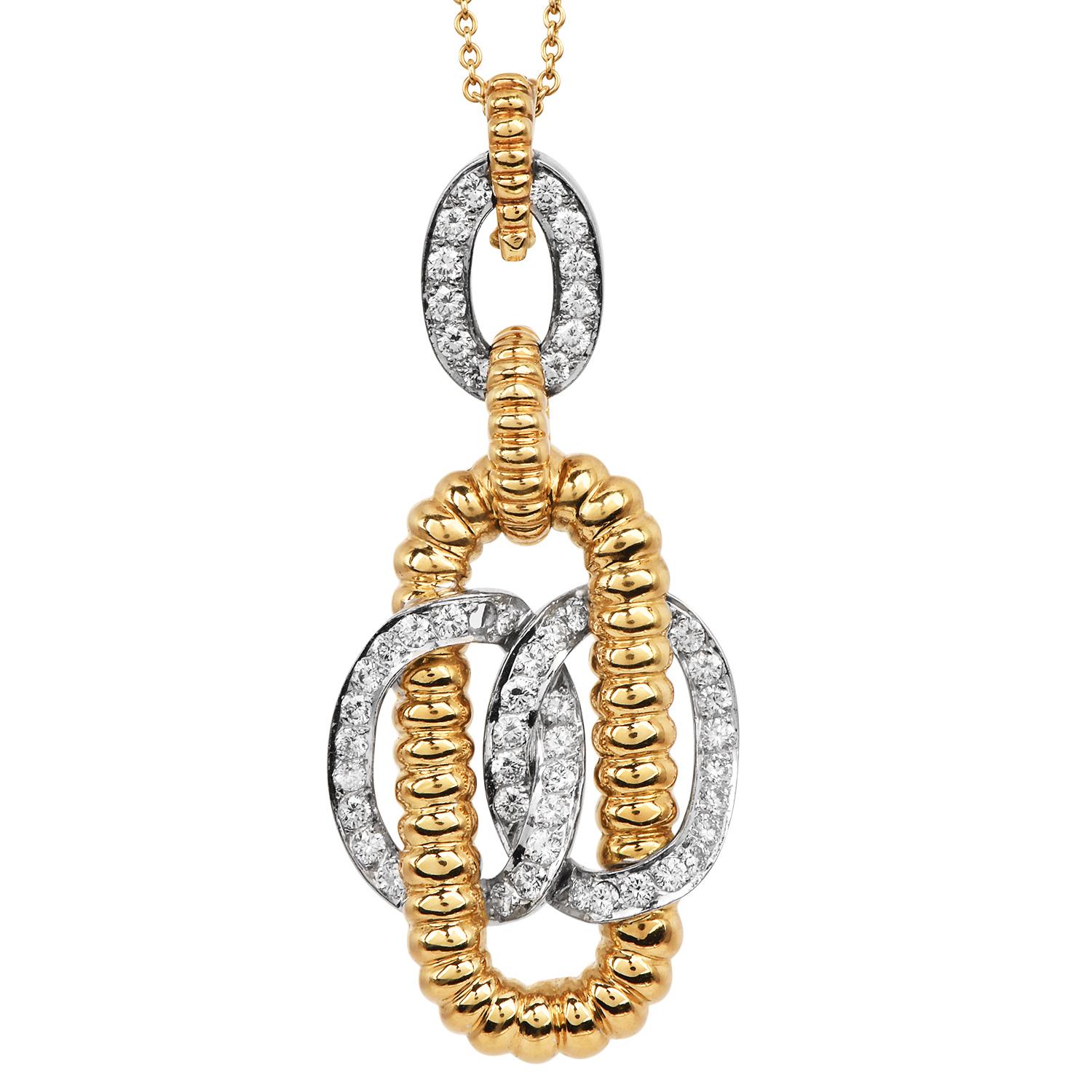 Exemple frappant du design britannique audacieux des années 1970, cette suspension vintage de Kutchinsky met en évidence le flair de la maison pour l'artisanat innovant et l'élégance sculpturale. Réalisée en or jaune 18 carats et en platine, la