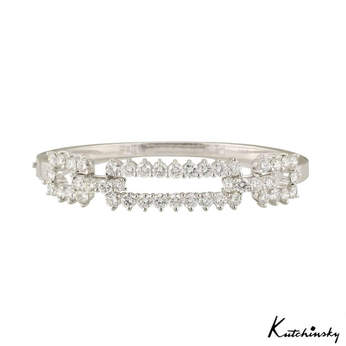 A stunning bangle in 18k white gold by Kutchinsky. The bangle features a diamond set openwork rectangular bar motif, set with 46 round brilliant cut claw set diamonds. The diamonds have a total weight of approximately 4.60ct, predominantly F colour