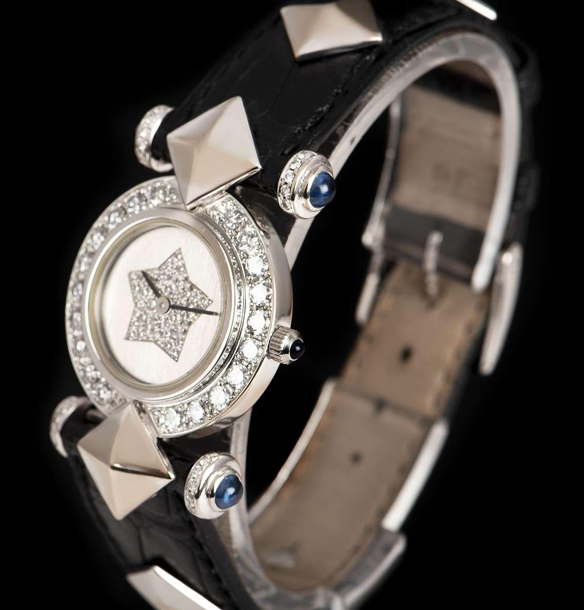 An 18k White Gold Ladies Dress Wristwatch, silver diamond dial, a fixed 18k white gold bezel set with approximately 20 round brilliant cut diamonds (~1.0ct), 18k white gold lugs each set with 5 round brilliant cut diamonds (~0.13ct) and a single