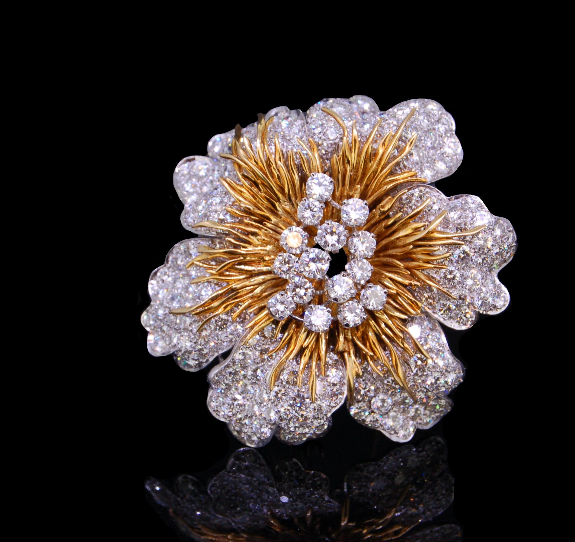 KUTCHINSKY, IMPORTANT 18 ct. BI-COLOR GOLD DIAMOND FLOWER HEAD BROOCH, 1970'S, designed as a flower head, central cluster of brilliant cut diamonds within a whorl of gold stylised stamen, to pavé set brilliant cut diamonds totalling approx. 34 ct.