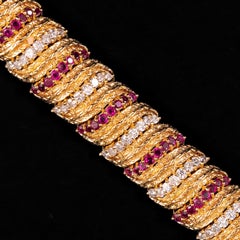 Kutchinsky Bracciale di metà secolo in oro giallo 18 carati con diamanti e rubini Inghilterra anni '60