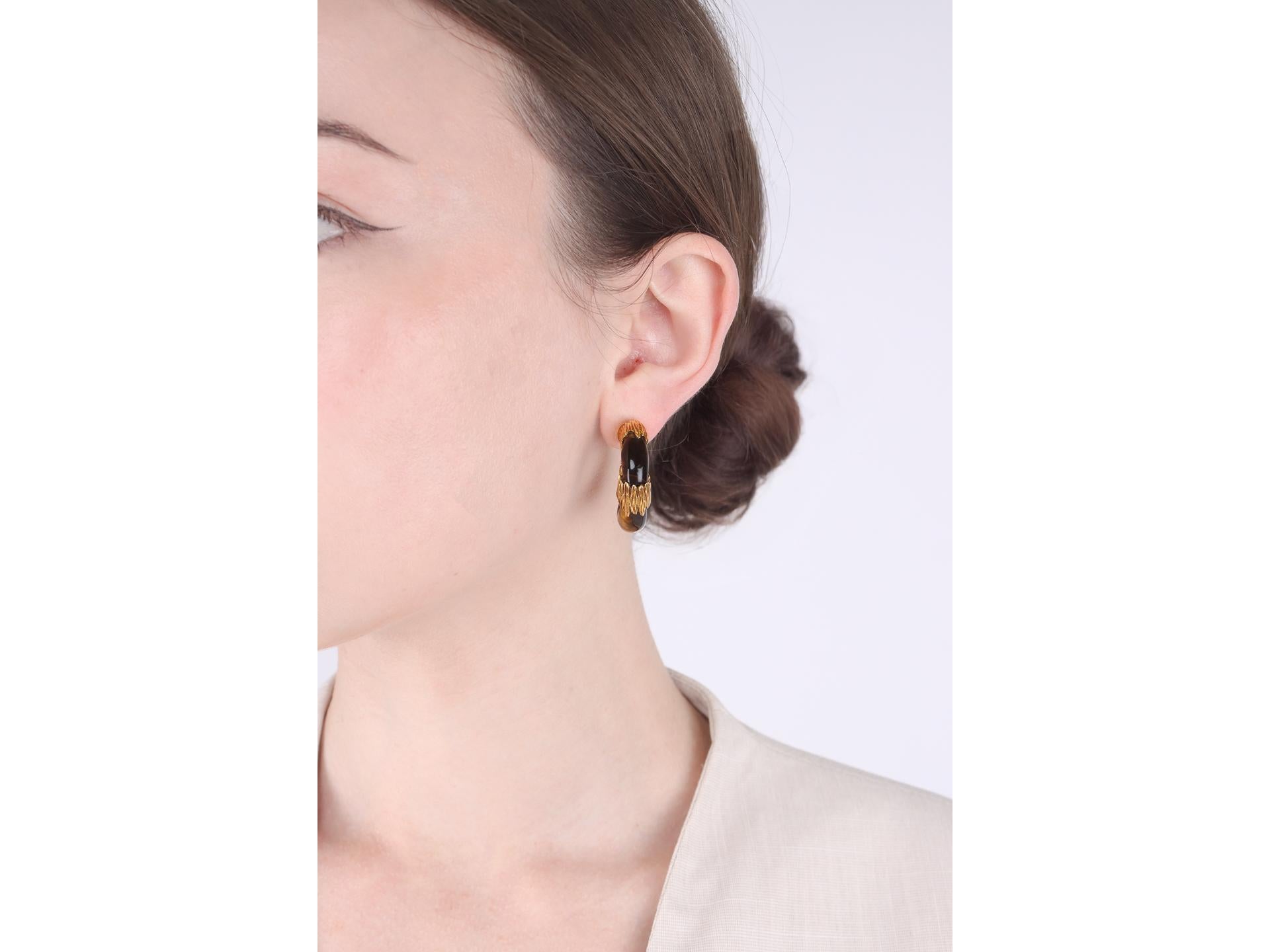 Kutchinsky tiger's eye hoop earrings, English, 1972. 1