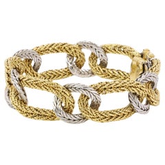 KUTCHINSKY Bracelet vintage tressé en or jaune et blanc