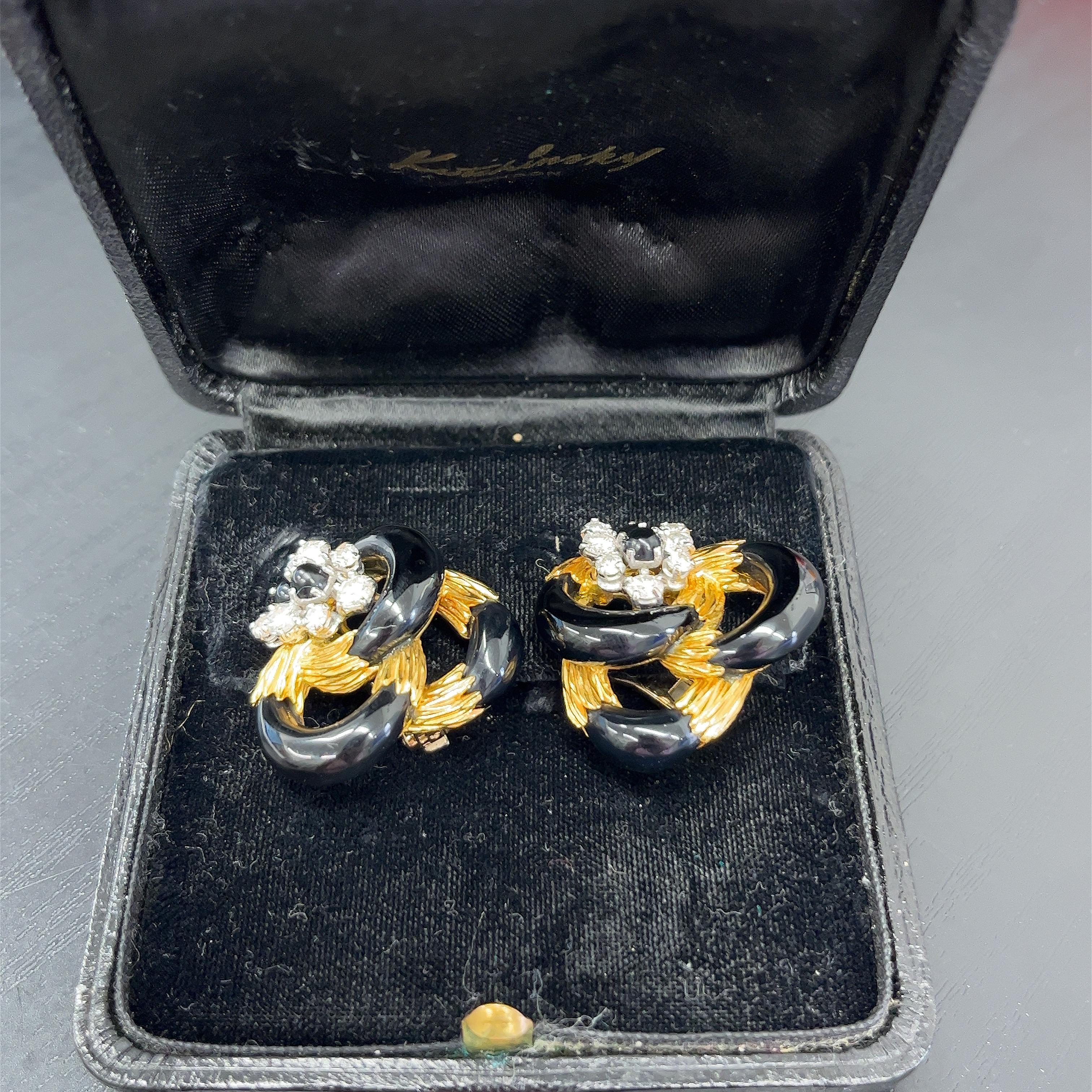These stunning Kutchinsky diamond and black enamel vintage earrings
are the perfect pair to add to your collection. 
They are set in 18ct yellow gold. 
The pair is set with 14 brilliant-cut diamonds, 1.0ct.
Total Diamond Weight: 1.0ct 
Diamond