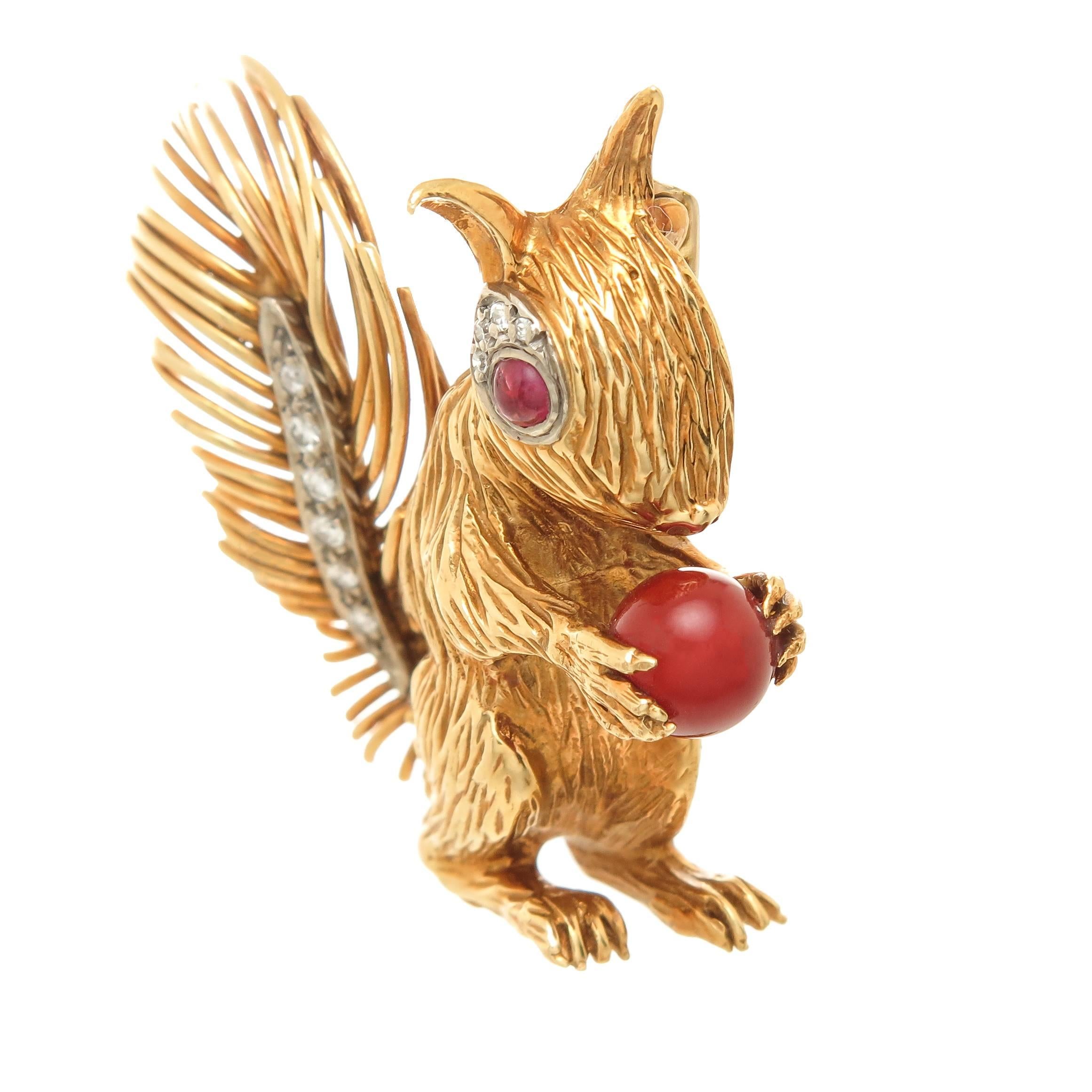 Circa 1980s Kutchinsky 18K Yellow Gold Squirrel Brooch, measuring 1 5/8 inch x 1 3/4 inch. very fine detailing, set with Diamonds, Rubies and a Chrysoprase. 