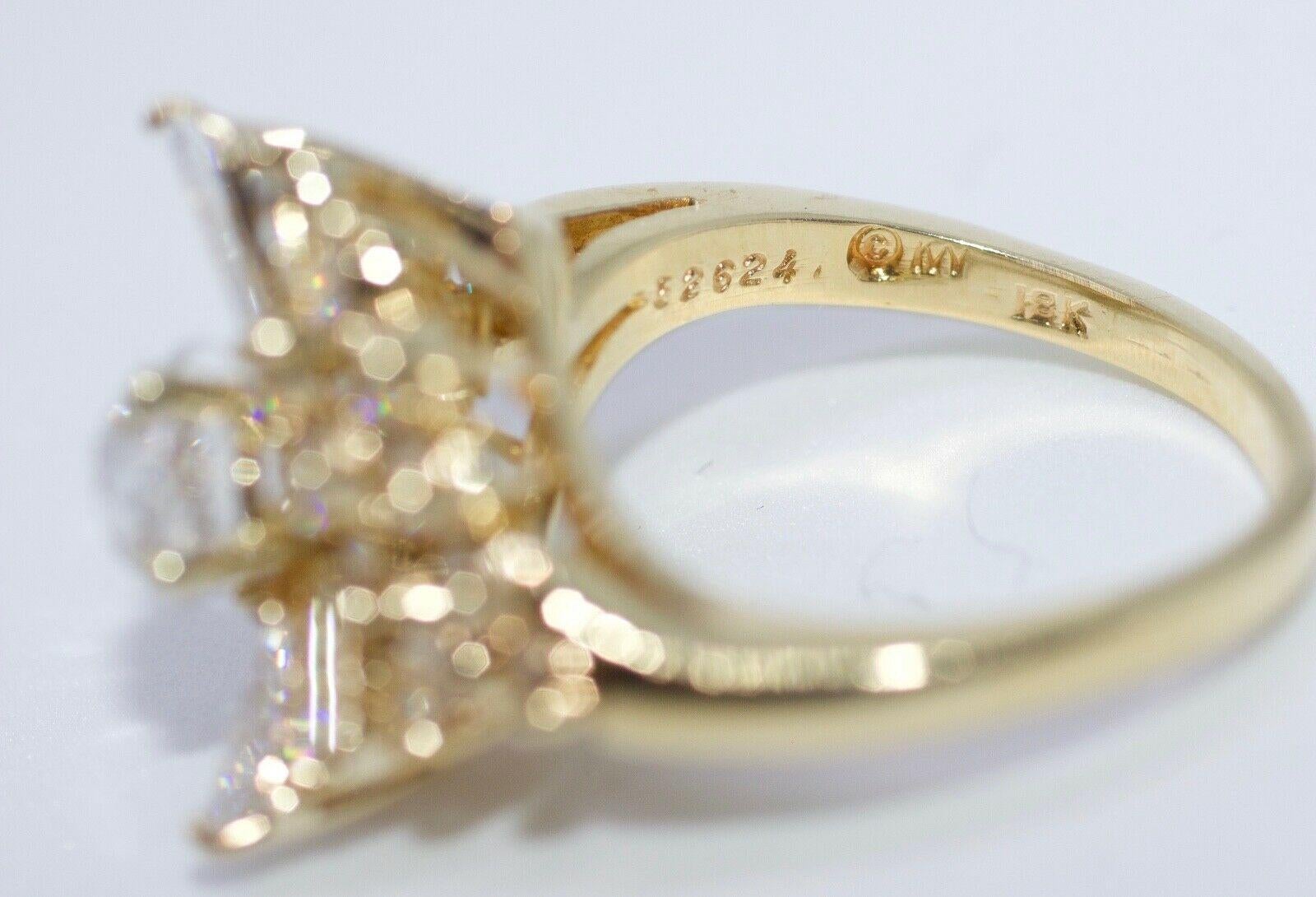 This is a gorgeous Kurt Wayne 18k Yellow Gold Round European Cut Diamond With Baguette And Round Diamonds Ring. This ring is size 6.5 and weighs in at 6.8 grams. The center diamond is a bright Round European  Cut Diamond that weighs .78 Carats. The