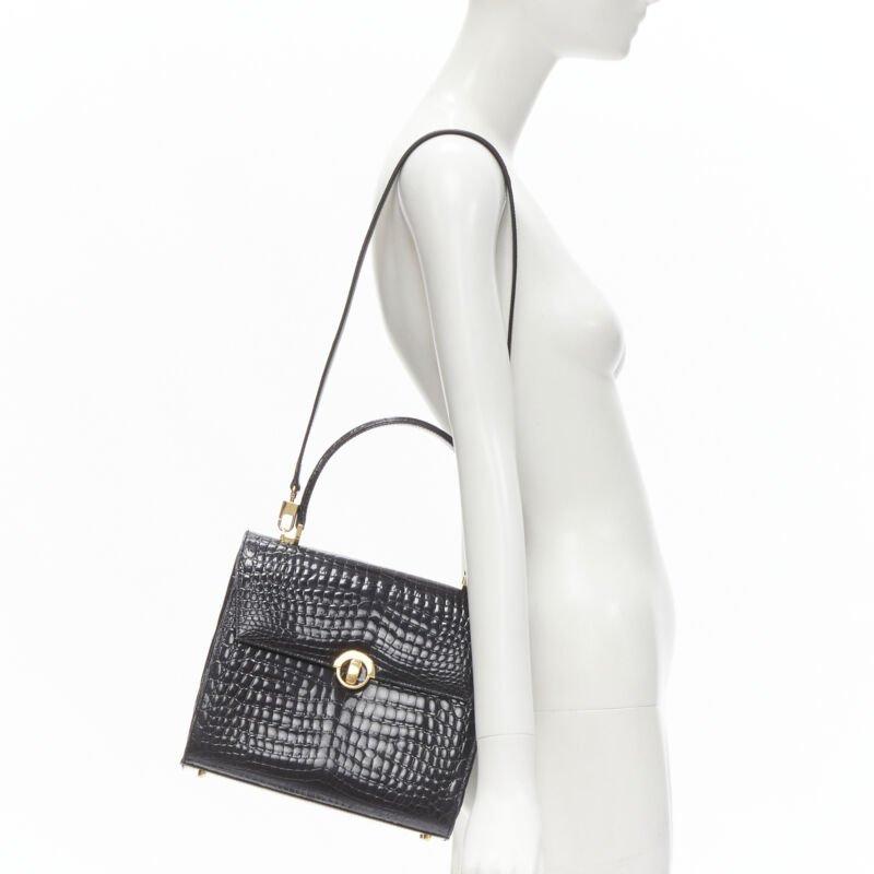 KWANPEN black polished leather gold turnlock crossbody flap satchel bag
Reference: ANWU/A00016
Brand: Kwanpen
Material: Leather
Color: Black, Gold
Pattern: Solid
Closure: Turnlock
Lining:  Leather
Extra Details: Polished shiny leather upper.