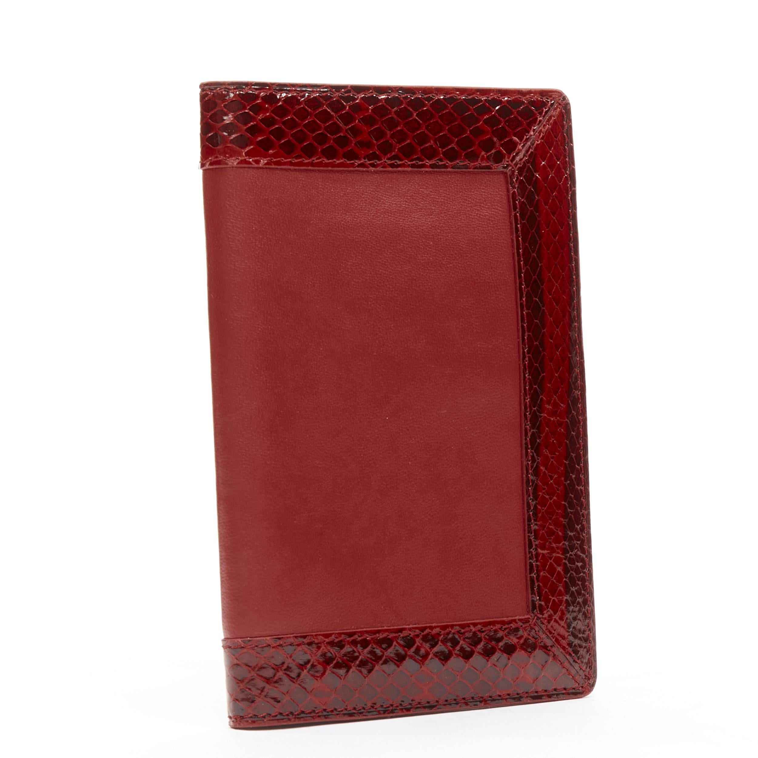 KWANPEN red glossy scaled leather trim bifold passport card holder
Brand: Kwanpen
Material: Calfskin Leather
Color: Red
Pattern: Solid

CONDITION:
Condition: Excellent, this item was pre-owned and is in excellent condition. 
Comes with: One dust