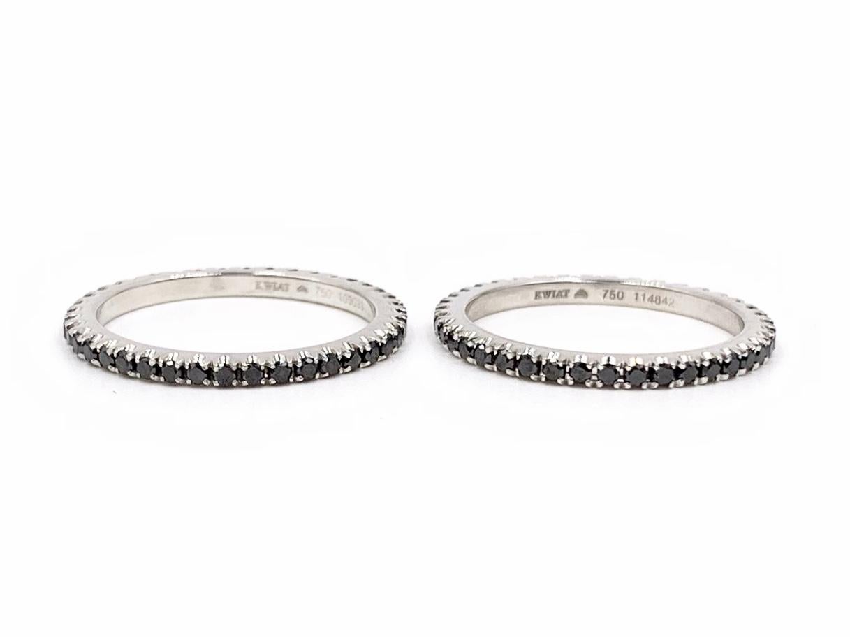 Designed with superior quality by American high jewelry artisan, Kwiat. Each of these 18 karat white gold 1.65mm stacking eternity bands feature .41 carats of polished black diamonds, perfectly pave set.
Both are finger size 5.5