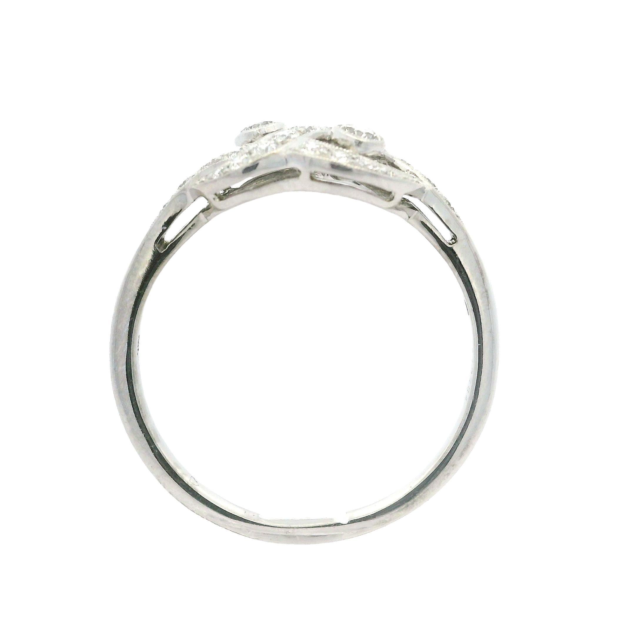 --Stone(s):--
(27) Natural Genuine Diamonds - Round Brilliant Cut - Pave & Bezel Set - VVS2-VS2 Clarity - E/F Color - 0.40ctw (approx.)

Material: Solid 18K White Gold
Weight: 3.47 Grams
Ring Size: 9.5 (Fitted on a finger. We can custom size this