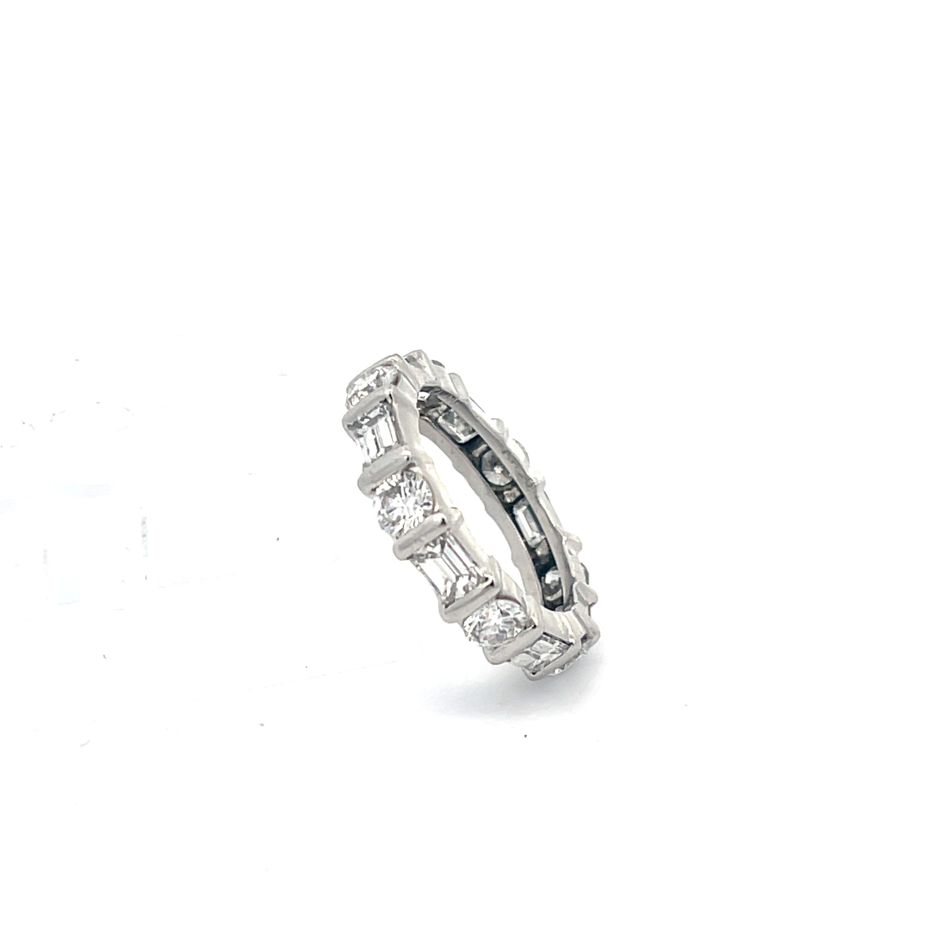 Kwiat Diamond Eternity Band in Platinum. The eternity band features approximately 3ctw of brilliant round and emerald cut diamonds. Size 5 1/4
6.4 Grams
4.3mm Wide