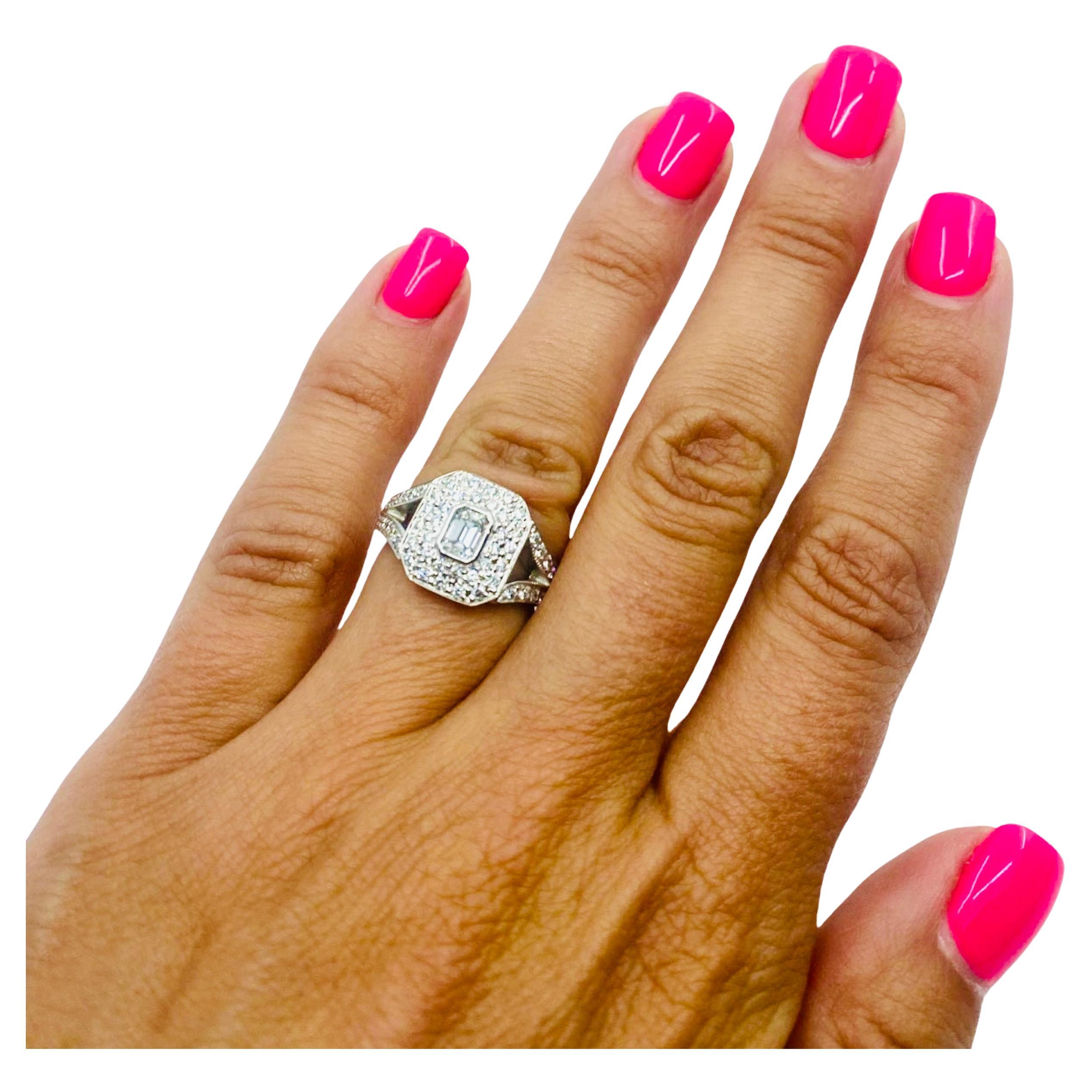 DESIGNER: Kwiat
CIRCA: 1990
MATERIALS: 18k White  Gold
GEMSTONE: Round Brilliant  Cut Diamond 
WEIGHT: 6.1 grams
RING SIZE: 5.5

A classic Kwiat diamond engagement ring in 18k white gold. The ring of a rectangular shape has an emerald cut diamond