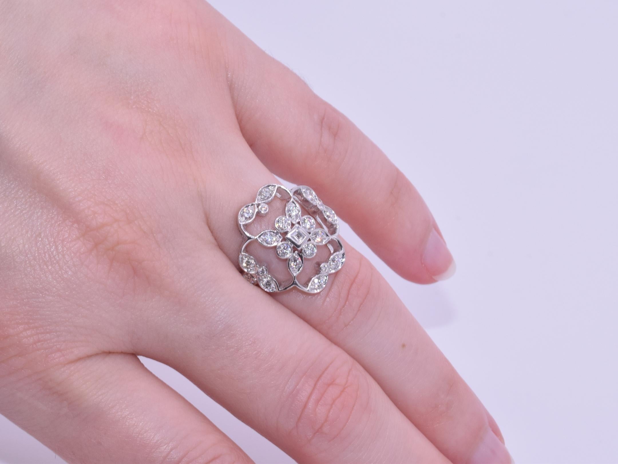 18k White Gold Diamond Ring, Signed Kwiat

This diamond ring is from the Kwiat Crochet Collection with one square cut and 26 round brilliant diamonds totaling, 0.69 carats GH/VS1-SI1.  The ring size is a 7.  The original retail was $2,275.

Since