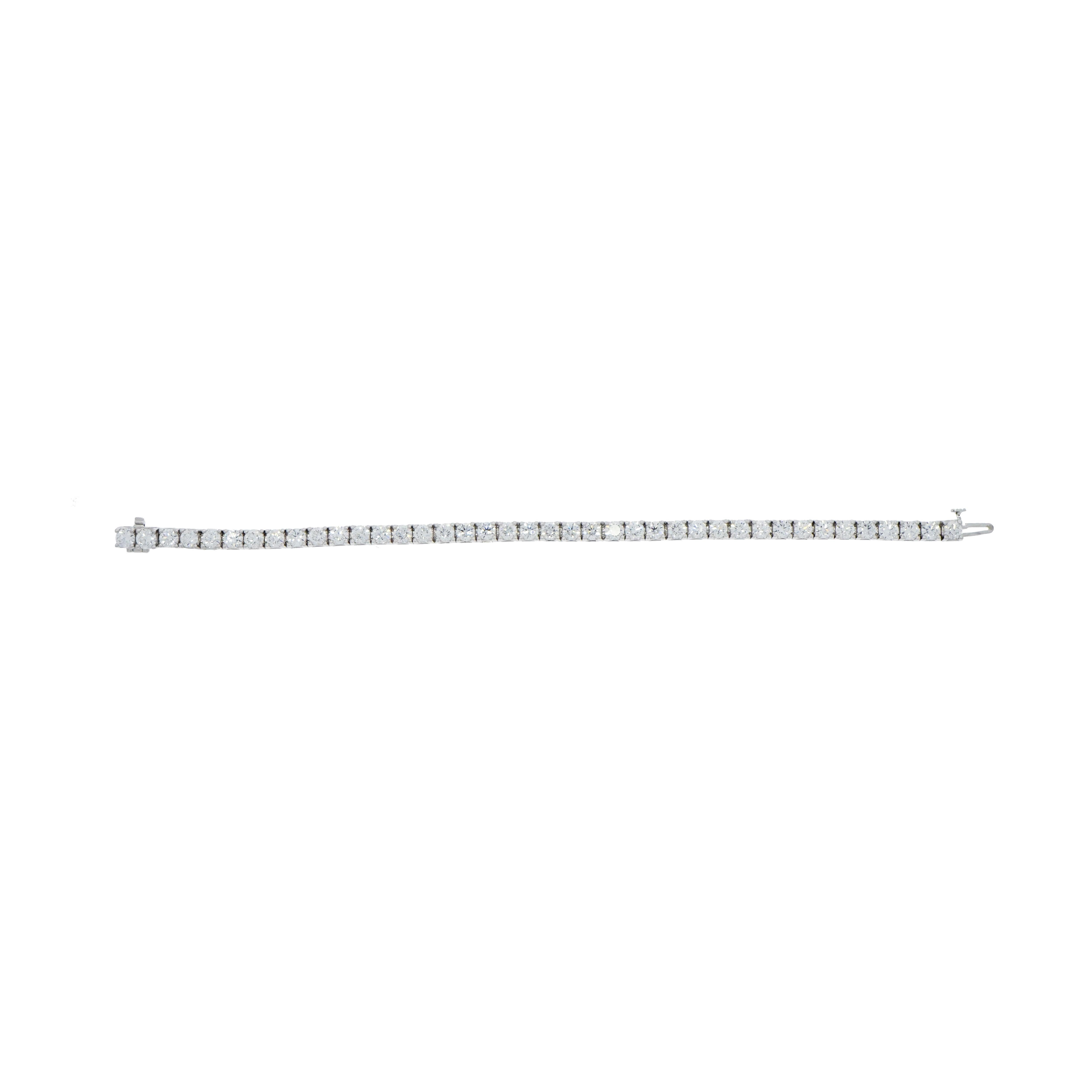 Classic and elegant design, obtained by harmoniously matching round brilliant cut diamonds set in a four prongs 18K white gold straight line tennis bracelet, weighing approximately 10 carats in total, F in color and VS clarity. Creating on your