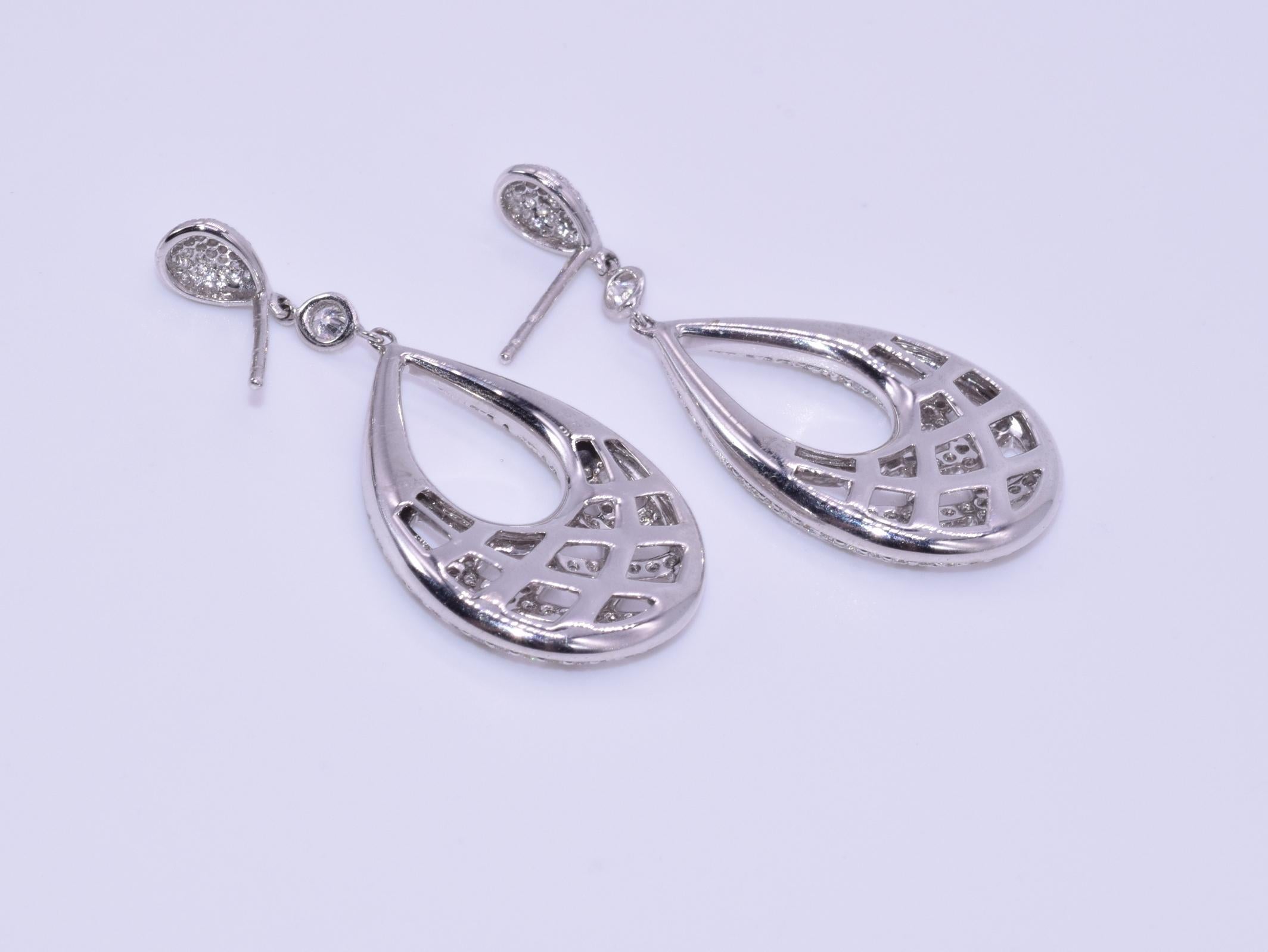 18k White Gold Diamond Earrings, Signed Kwiat

These earrings are from the Jacquard Collection with 376 round brilliant diamonds totaling 1.63 carats, FG/VS mounted in 18k white gold.  The original retail was $16,800.

Since 1907, Kwiat has led the