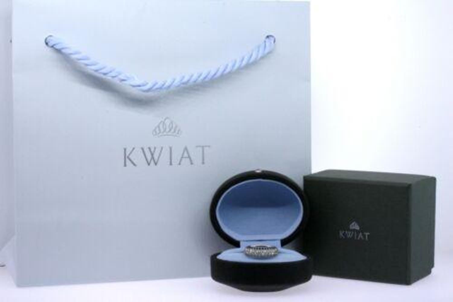 Here we have a Kwiat 3-row pave diamond band estimated 2.04ctw size 6.
Currently, Kwiat only has a 2.5mm .70ctw 3-row moonlight band for $3300, or a 4-row 1.44ct for $6450. Both versions have much smaller diamonds.
The 6-row version has 2.16ctw and