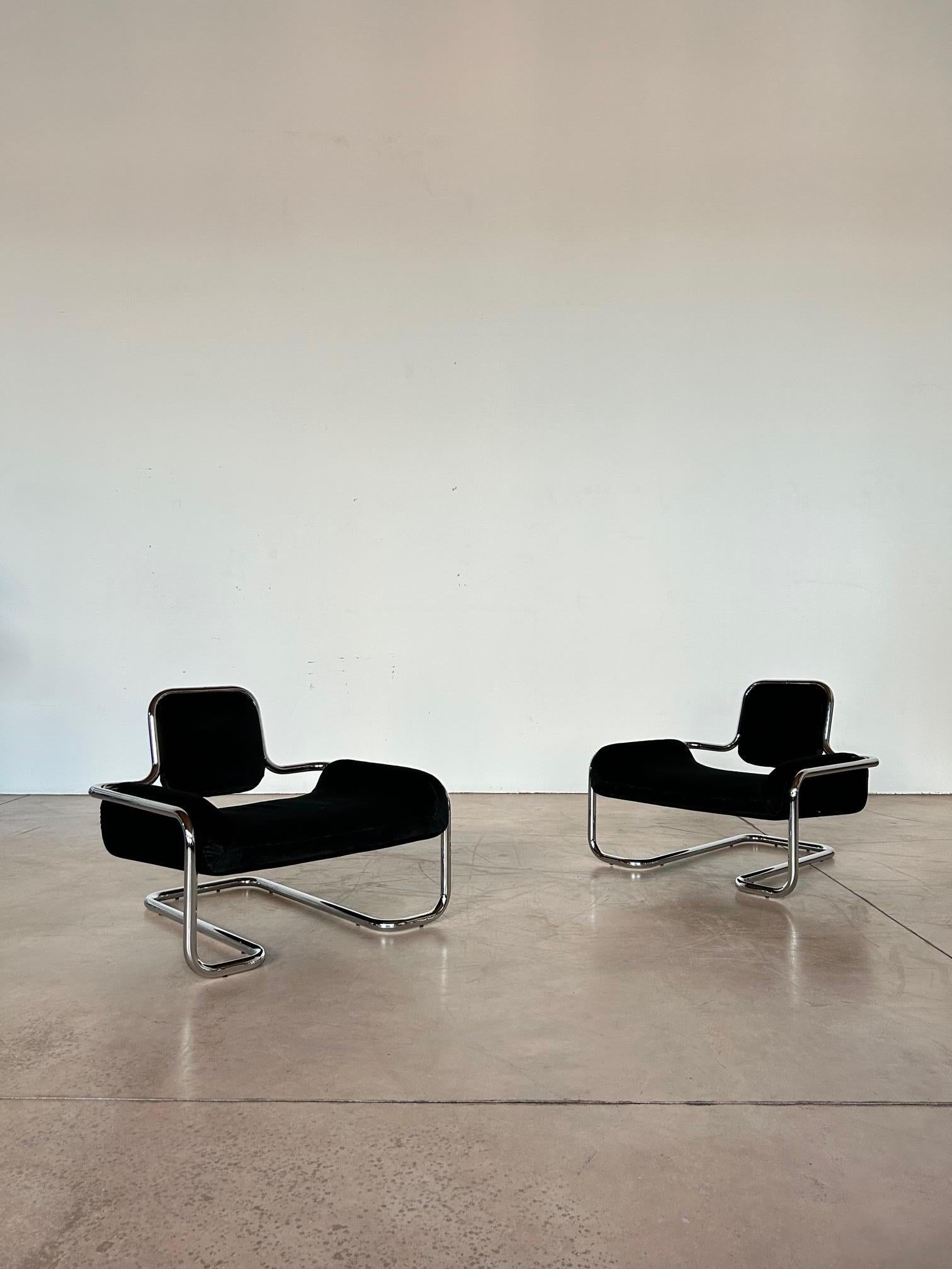 Set of a pair oif Kwok Hoi Chan Limande chairs black linen velvet ed. Steiner, France, 1970s.
Chromed steel tube frame, plastic feet, absolute black linen velvet upholstery; perfect conditons. 
Kwok Hoi Chan (1939 – 1987) was a Chinese architect