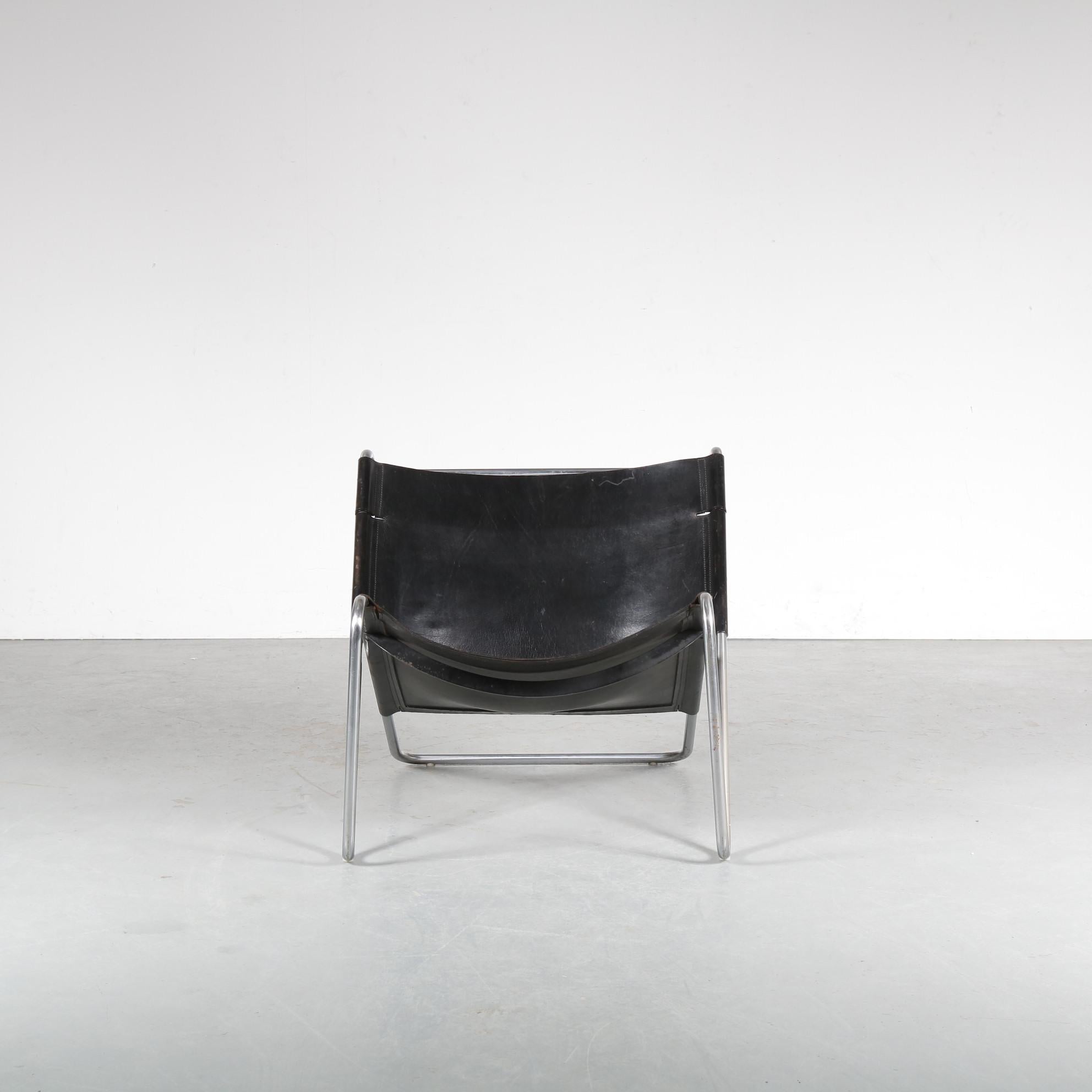 An impressive lounge chair designed by Kwok Hoi Chan, manufactured by Spectrum in the Netherlands around 1970.

The piece has a tubular, chrome plated metal frame that holds the black neck leather upholstery. This thick quality leather provides an