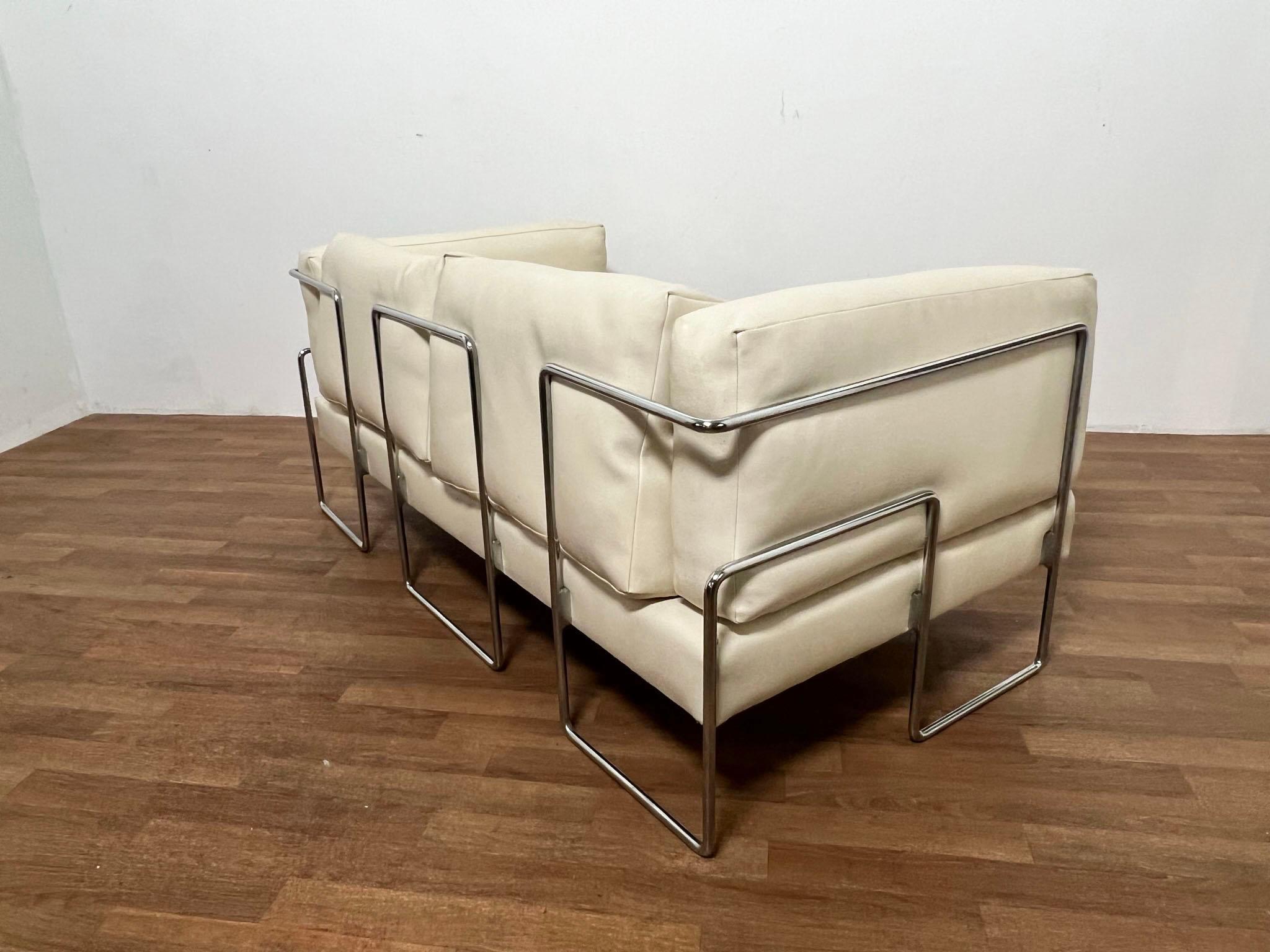 A Bauhaus inspired loveseat sofa by the influential Chinese architect Kwok Hoi Chan (1939-1990), for Steiner of France, ca. 1960s.