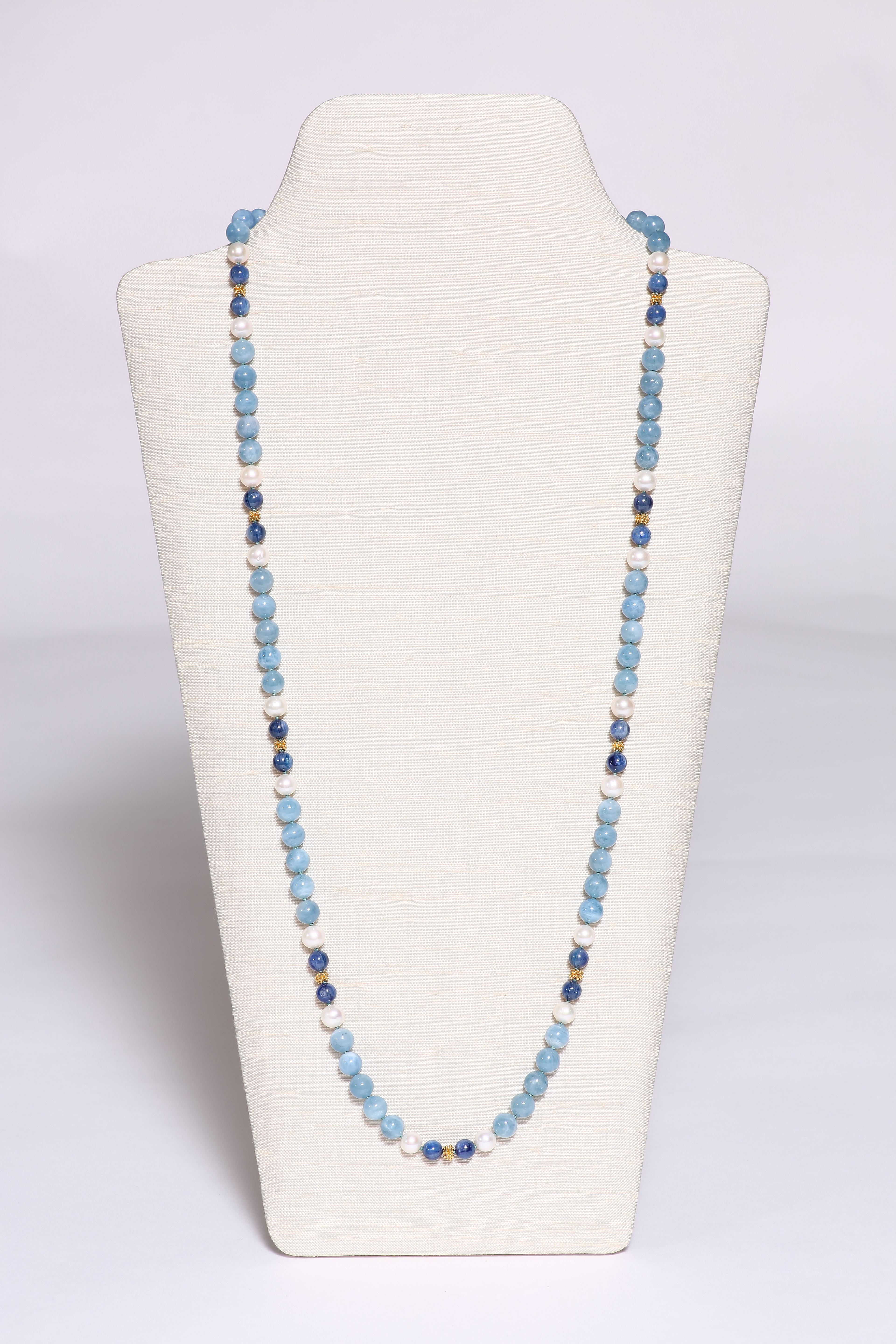 Two different tones of wonderful blue kyanite and aquamarine beads, spaced by fresh water pearls and 18k faceted gold beads, forms a 34 1/4