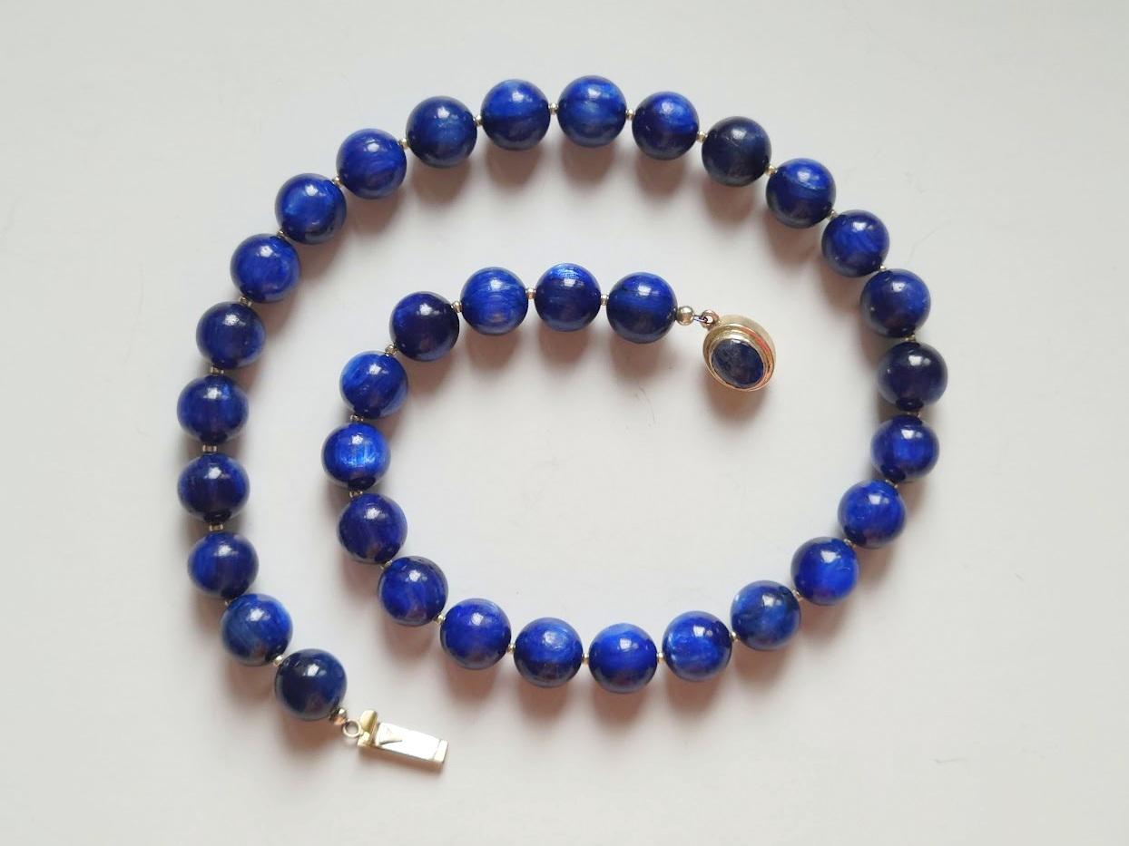 The length of the necklace is 18 inches (45.7 cm). The rare size of the smooth round beads is 12 mm.
The color of the beads is saturated blue with a silk effect and inner glow. Very high-quality kyanite beads!
The color of the beads is authentic and