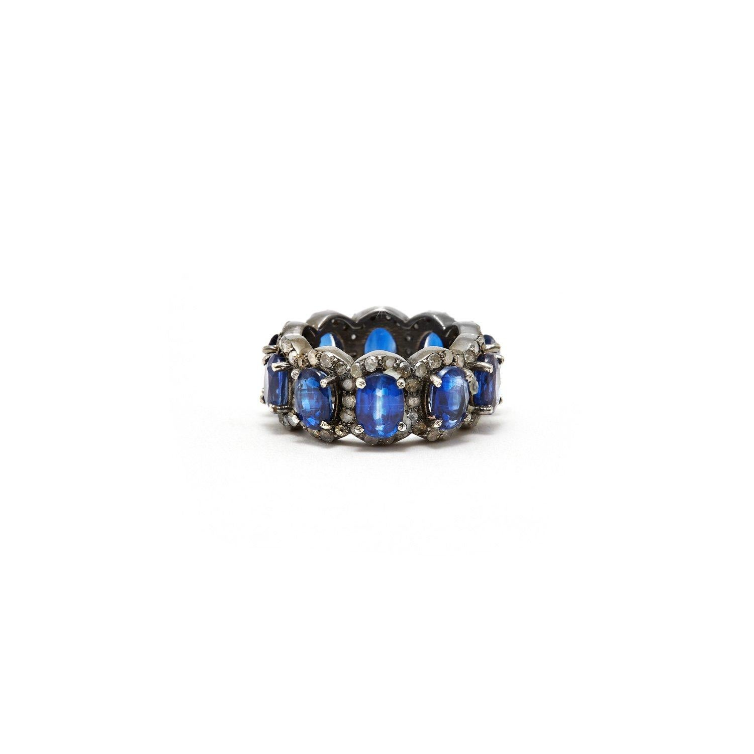 Stunning blue Kyanite baguettes accented with white Diamonds in a blackened silver band reminiscent of an Art Deco Tiara.

- Natural Blue Kyanite.
- White Diamonds.
- Set in Blackened Oxidized Silver.