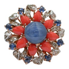 Cianita, Zafiros, Corales, Diamantes, Anillo de Oro Rosa y Plata.