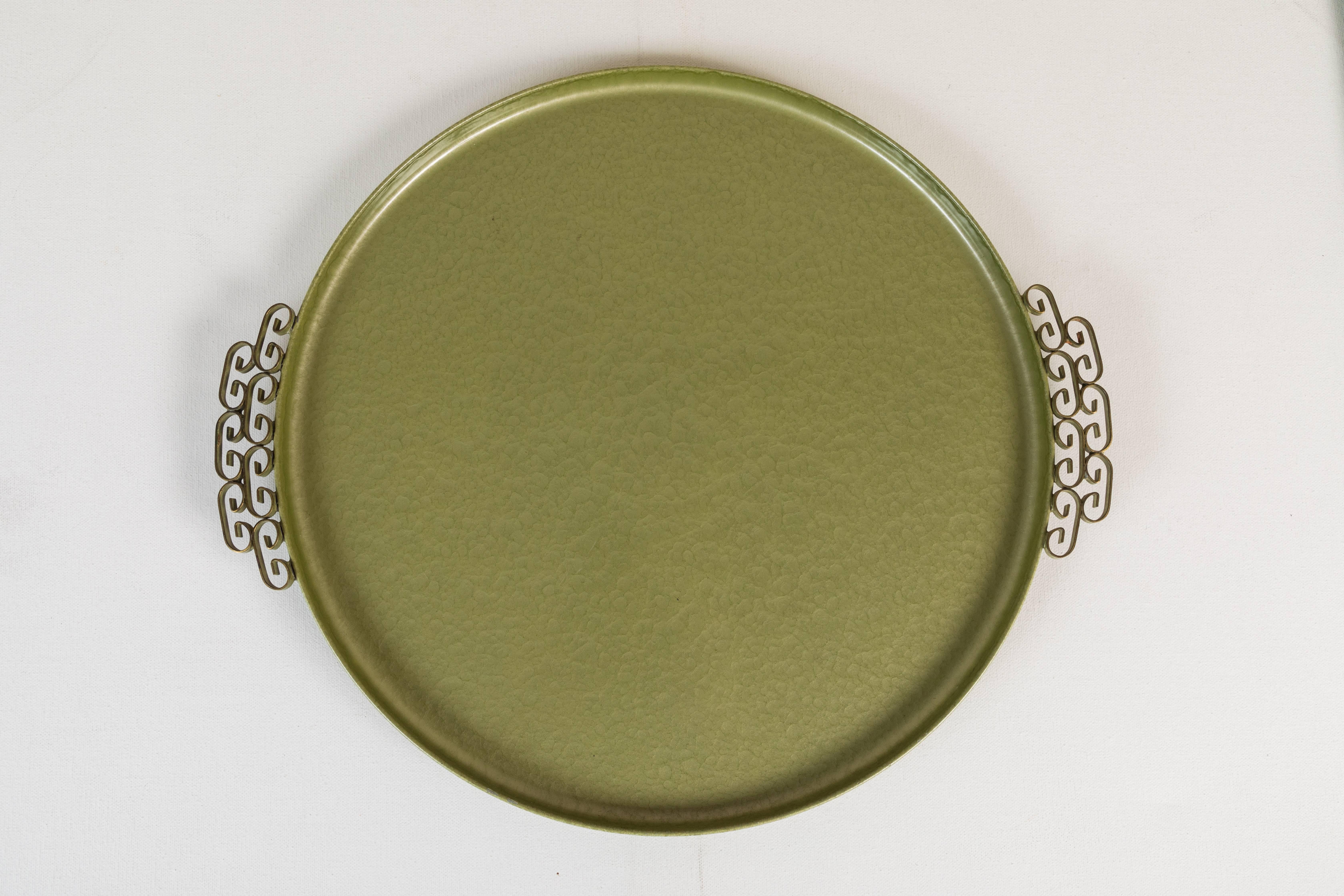 A circa 1950s Moiré Glaze serving tray by Kyes of Pasadena, California. This handmade tray is rectangular and composed of hammered metal with a teal enamel finish. It has two brass ornamental side handles. The base is marked “Moiré Glaze Kyes /