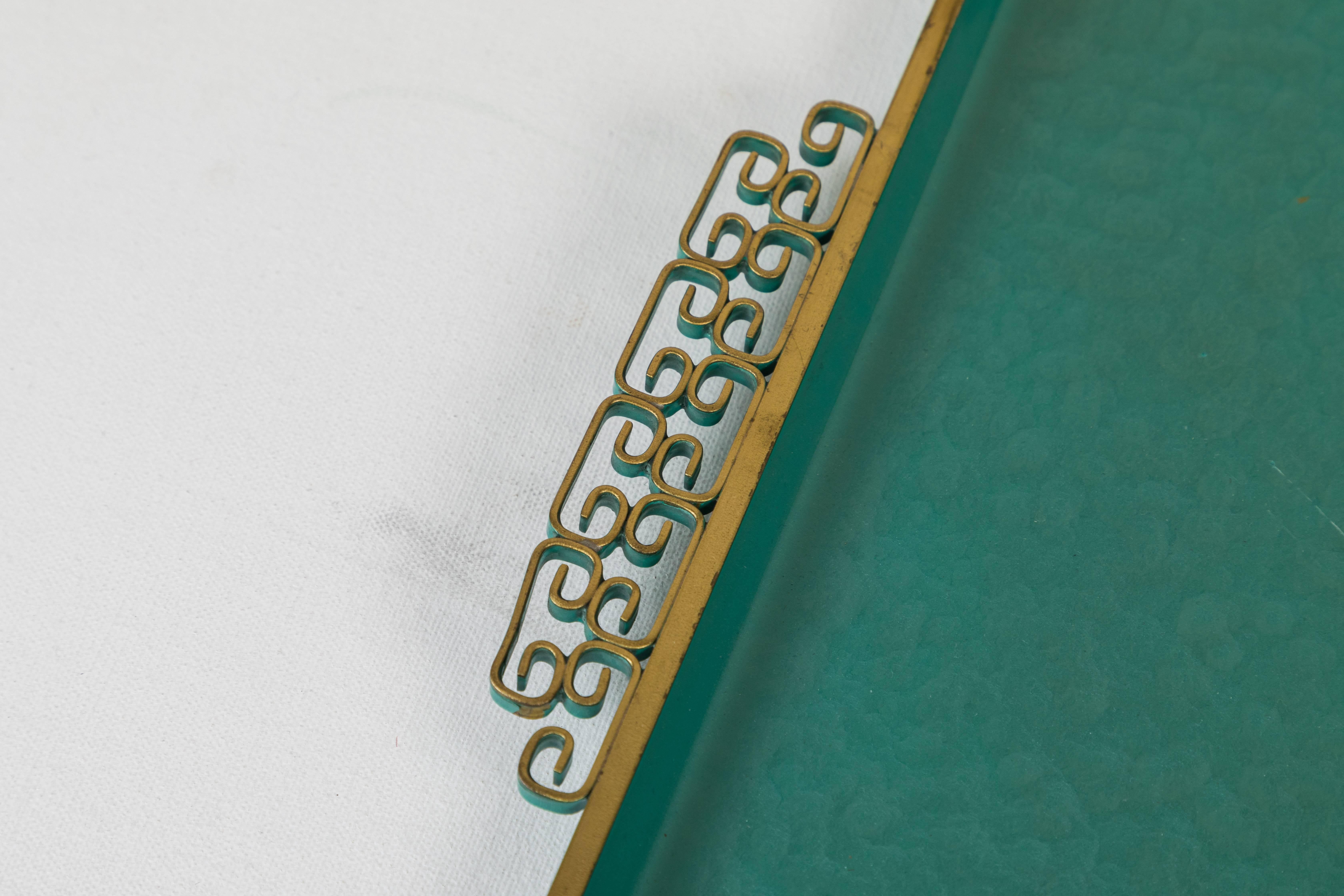 A circa 1950s Moiré Glaze serving tray by Kyes of Pasadena, California. This handmade tray is rectangular and composed of hammered metal with a teal enamel finish. It has two brass ornamental side handles. The base is marked “Moiré Glaze Kyes /