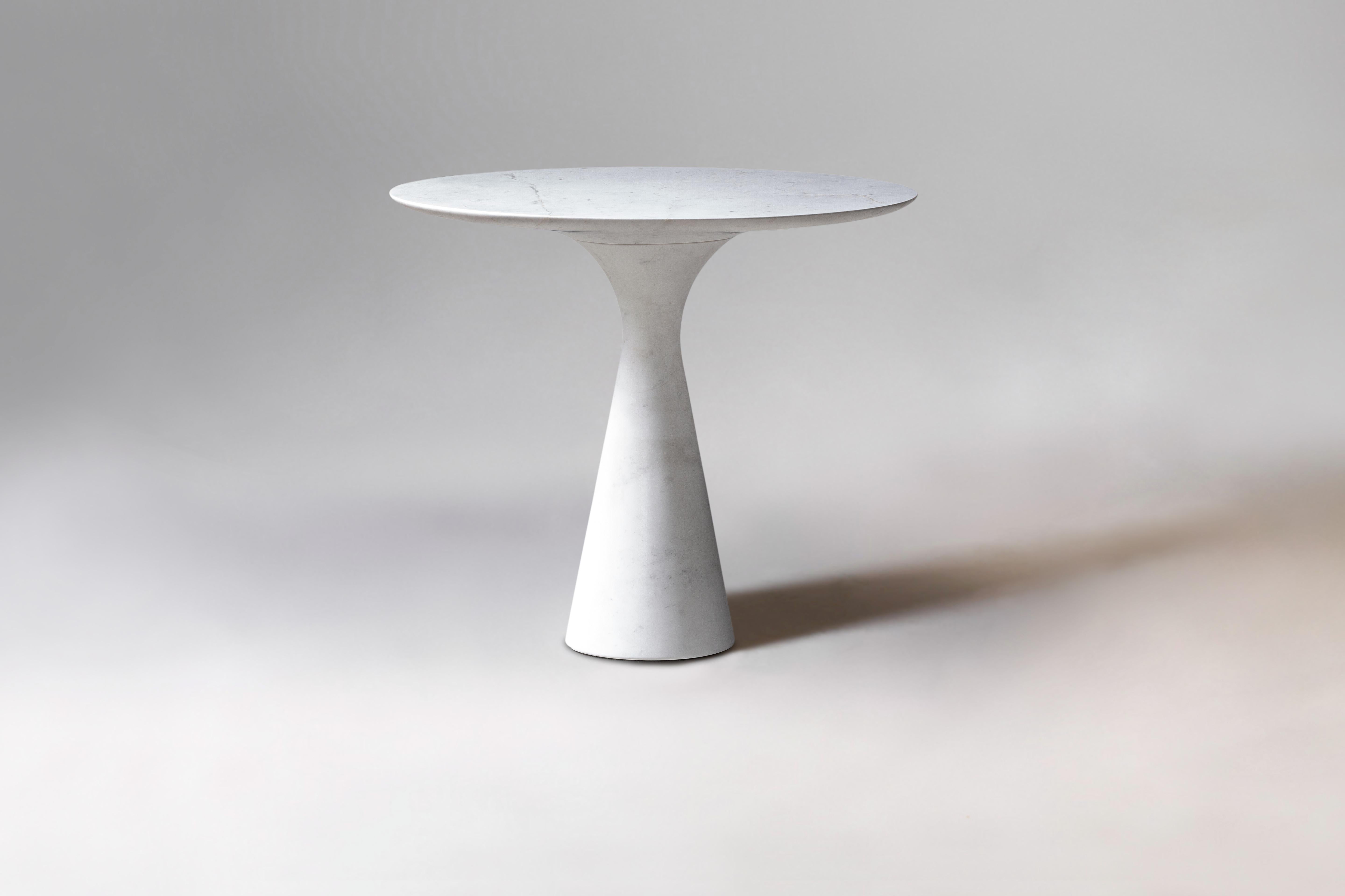 Kynos refined contemporary marble side table 62/45.
Dimensions: diameter 45 x height 62 cm.
Materials: Kynos

Angelo is the essence of a round table in natural stone, a sculptural shape in robust material with elegant lines and refined