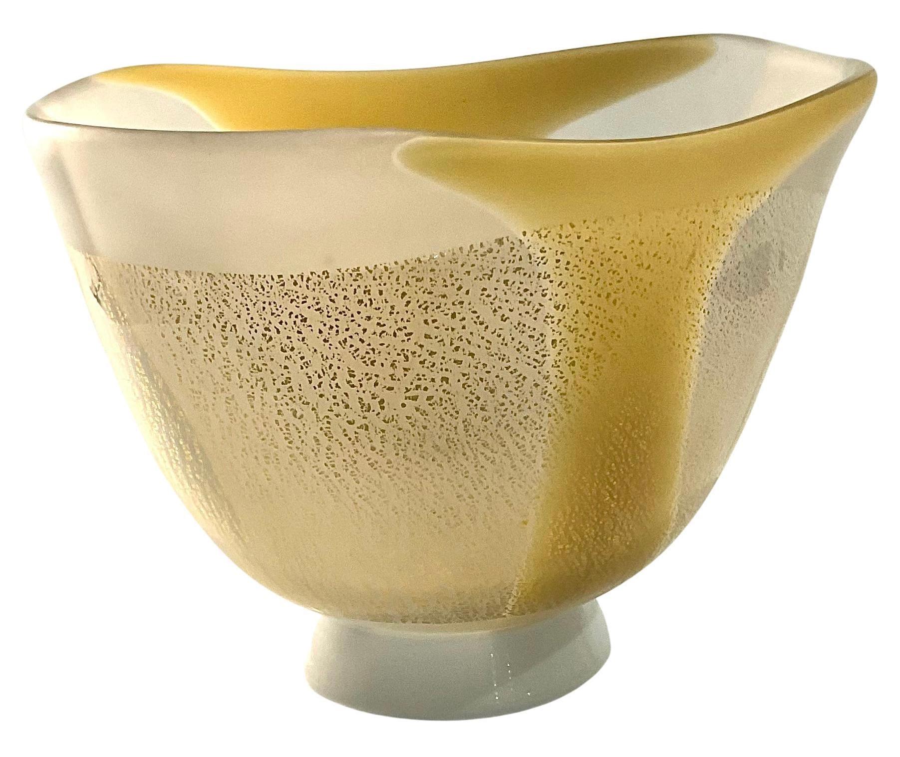 Kyohei Fujita Japanese Studio Glass Vase signed by the artist In white pasta glass with gold foil highlights. 

Kyohei Fujita (?? ??, Fujita Kyohei, 1921 – September 18, 2004) was a Japanese glass artist. He received training early in his career