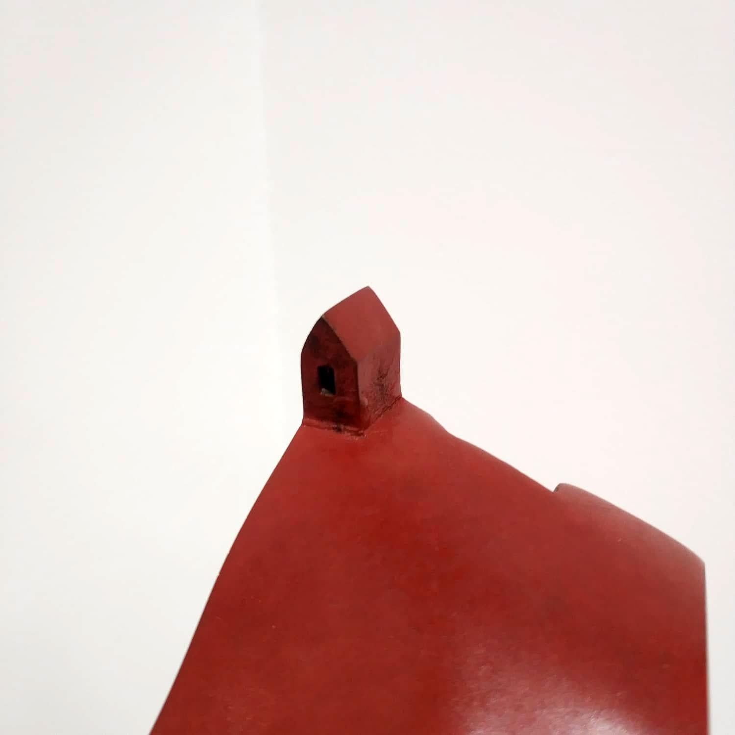 This intimate bronze sculpture by renowned Japanese artist Kyoji Nagatani presents a minimalist architectural form rendered in pristine white patina. Measuring 10 x 8 x 8 cm and weighing 950 grams, the piece depicts a simplified house structure with