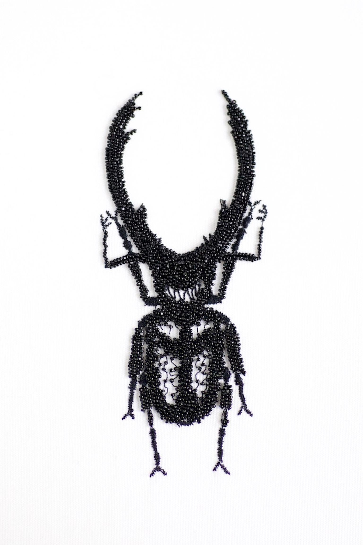 Embroidered insects by Kyoko Sugiura: Insect figured French embroidery in black pearls. 
