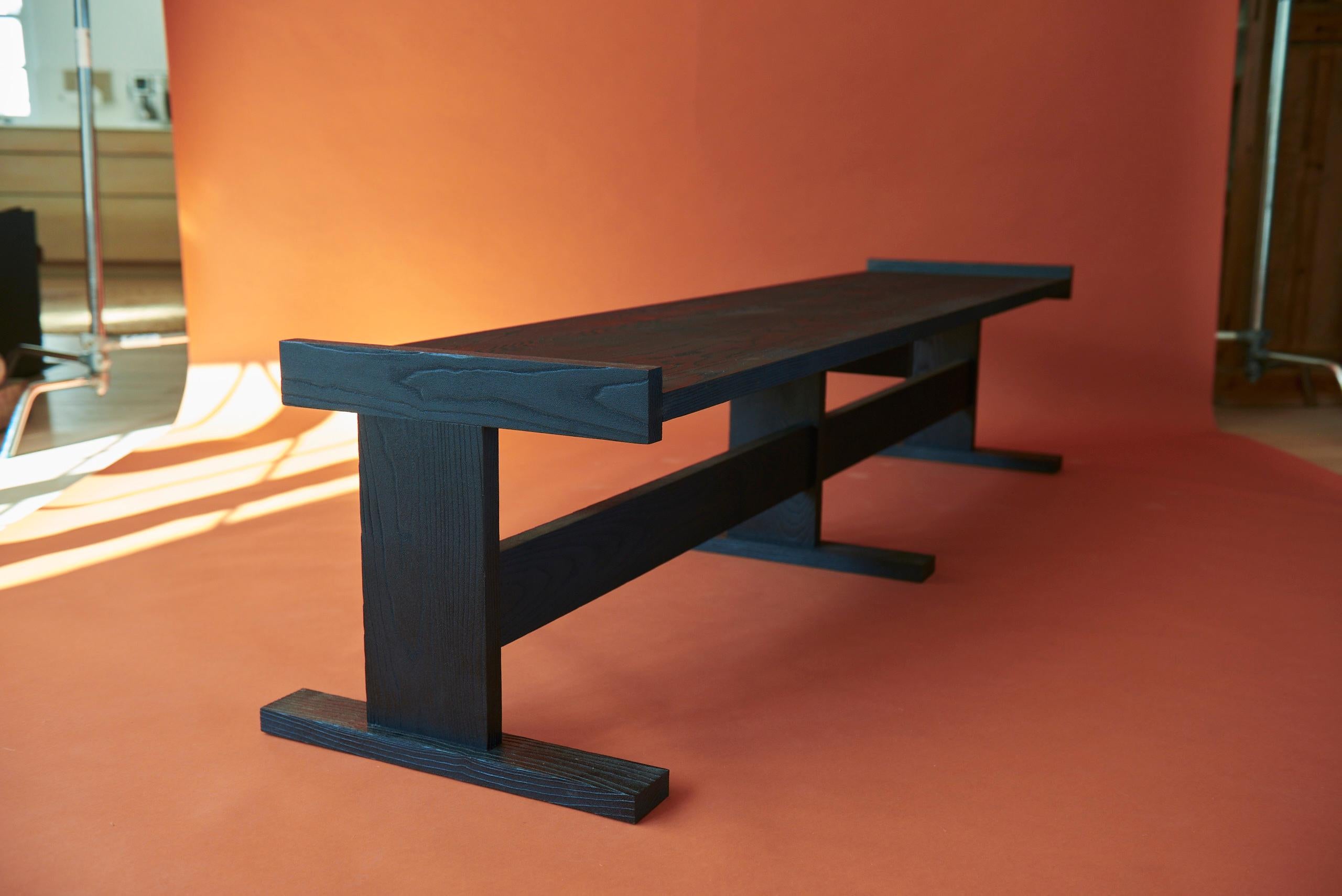 Ash Kyra Bench by Nish Studio
Dimensions: W 51.5 x D 207 x H 47.5cm.
Materials: Carbon stained + Sand Blasted Ash
**Price without cushion. 

N I S H is a Cape Town based Fashion and Furniture design studio. N I S H creates contemporary, elegant and