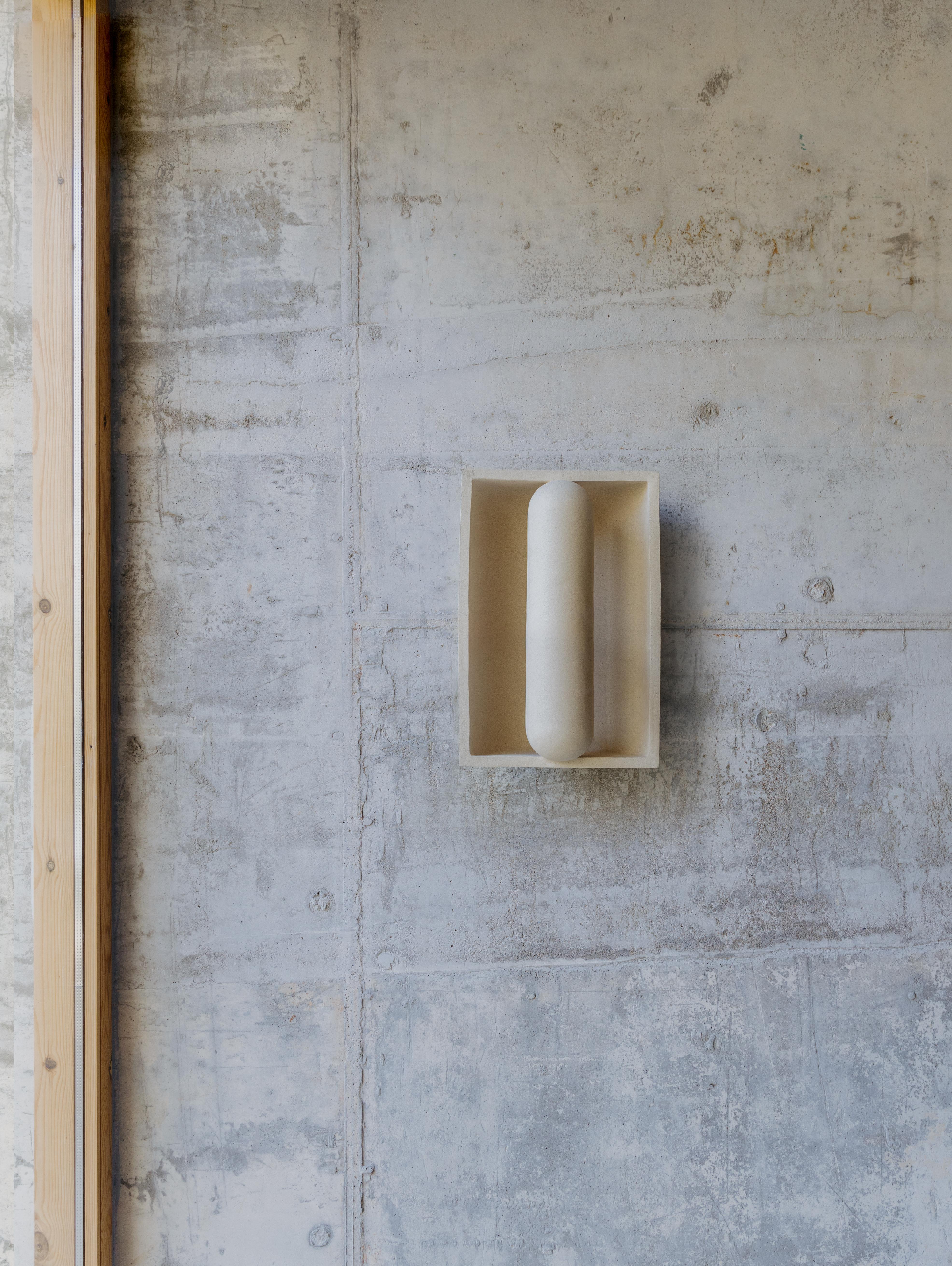 Kyrtos wall light by Lisa Allegra
Dimensions: W 22.5 x D 17,5 x H 33,5 cm
Materials: Clay

Born in 1986 in Paris, Lisa Allegra has earned in 2010 a degree in furniture design from the École Supérieure des Arts Décoratifs. She has worked for Tsé&Tsé