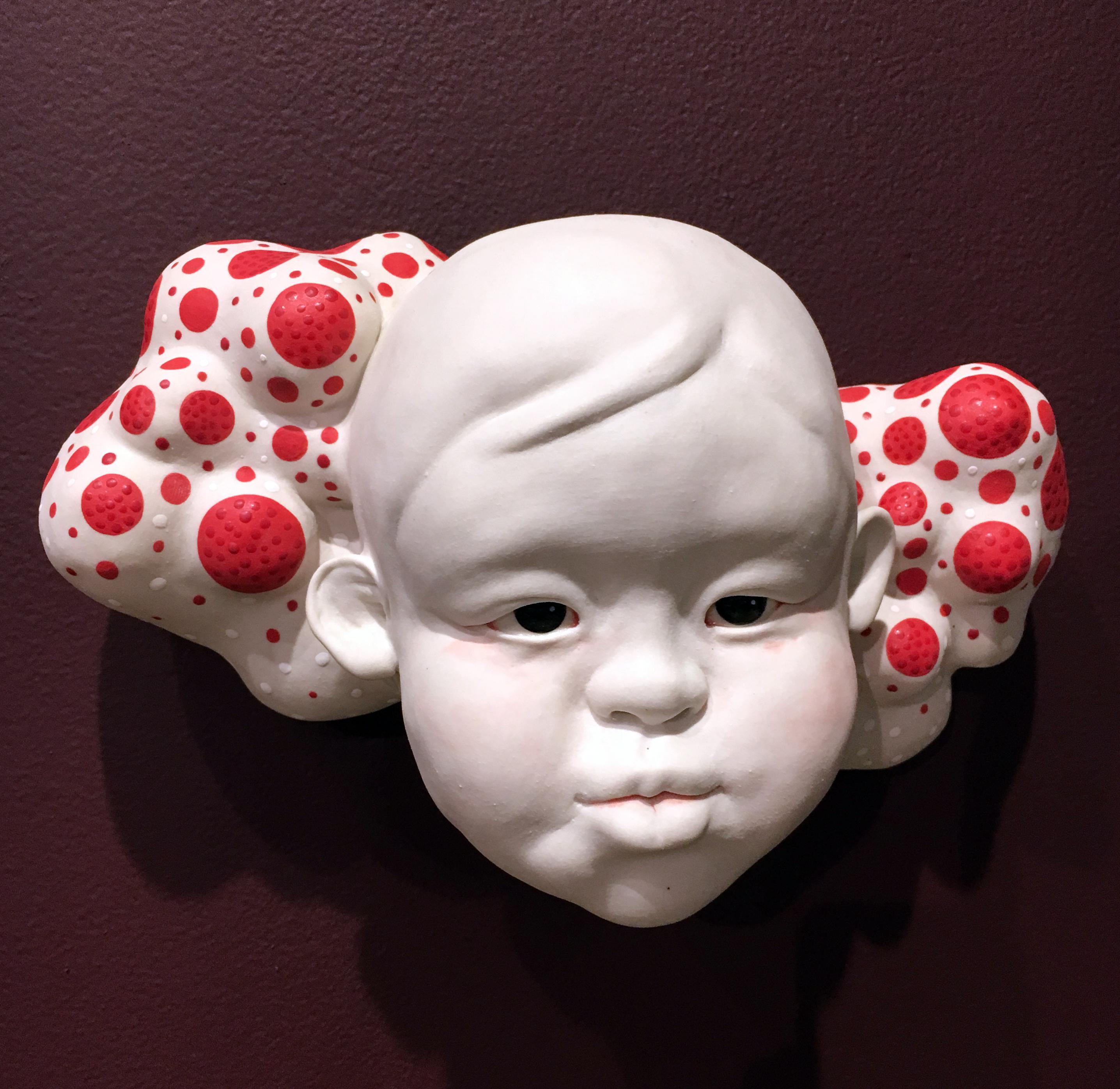 Kyungmin Park is a figurative ceramic sculptor drawing inspiration from childlike perspectives. Contrasting the darker emotions and restricted psyche of adulthood with the boundless consciousness of children, Kyungmin’s sculptures confront the view