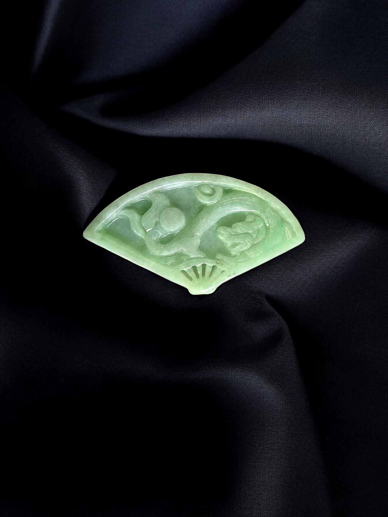 Inspired by Japanese Royalty, the 'Kyushu Carved Dragon Burmese A-Jadeite Fan Ornament Showpiece' is created from handpicking the rarest Burmese A-Jadeite Jade, with the high translucency, hues, tones and saturation of green. Symbolic of the Ancient