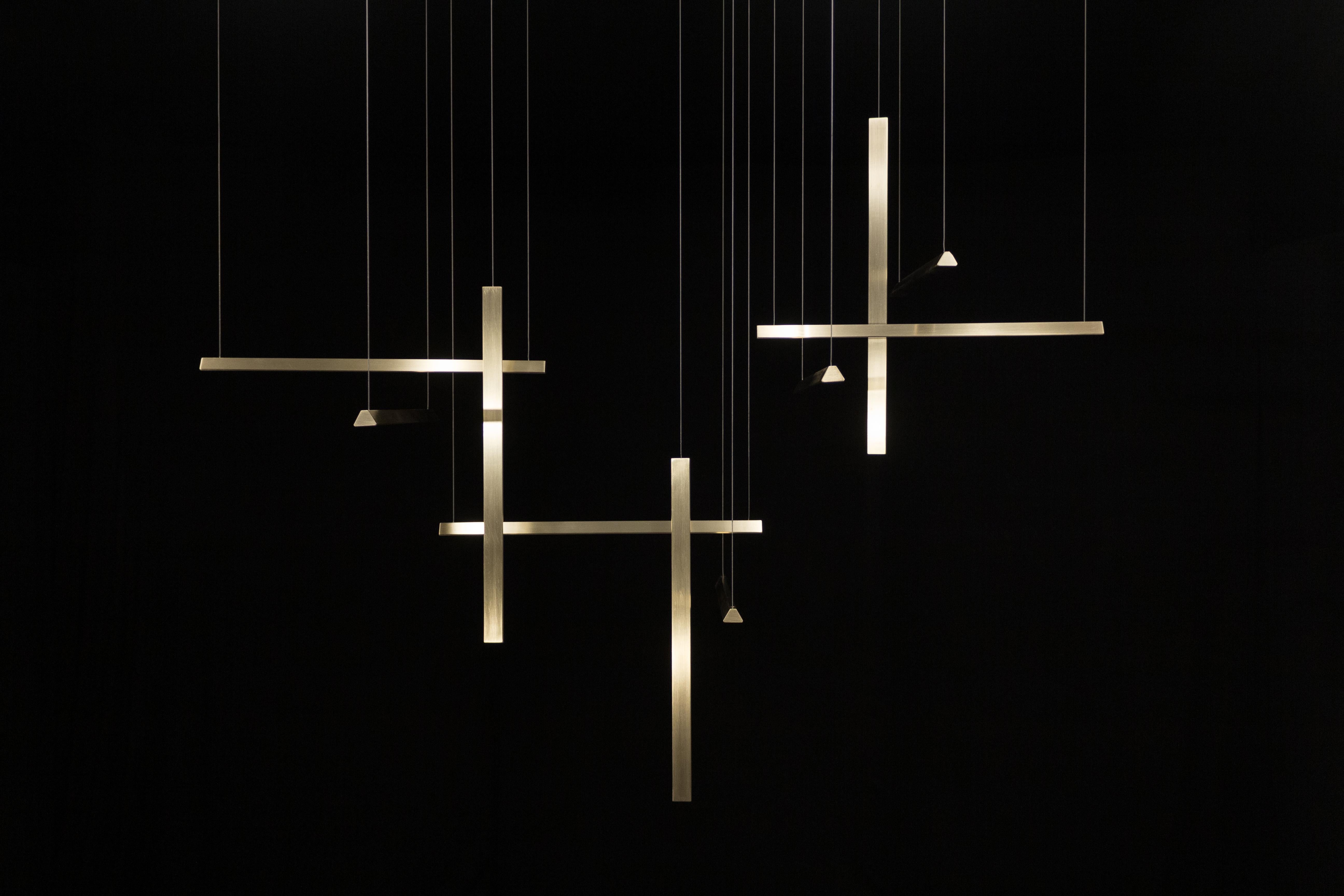 L 2500 Prisms Pendant Lamp C by Tanuj Arora
Dimensions: D 53 x W 250 x H 100 cm.
Materials: Solid Brass.
There are two kinds of prisms, 500 mm length and 360 mm length. They weigh approx. 1.7 kg and 1.2 kg each.
Total installation weight around 28