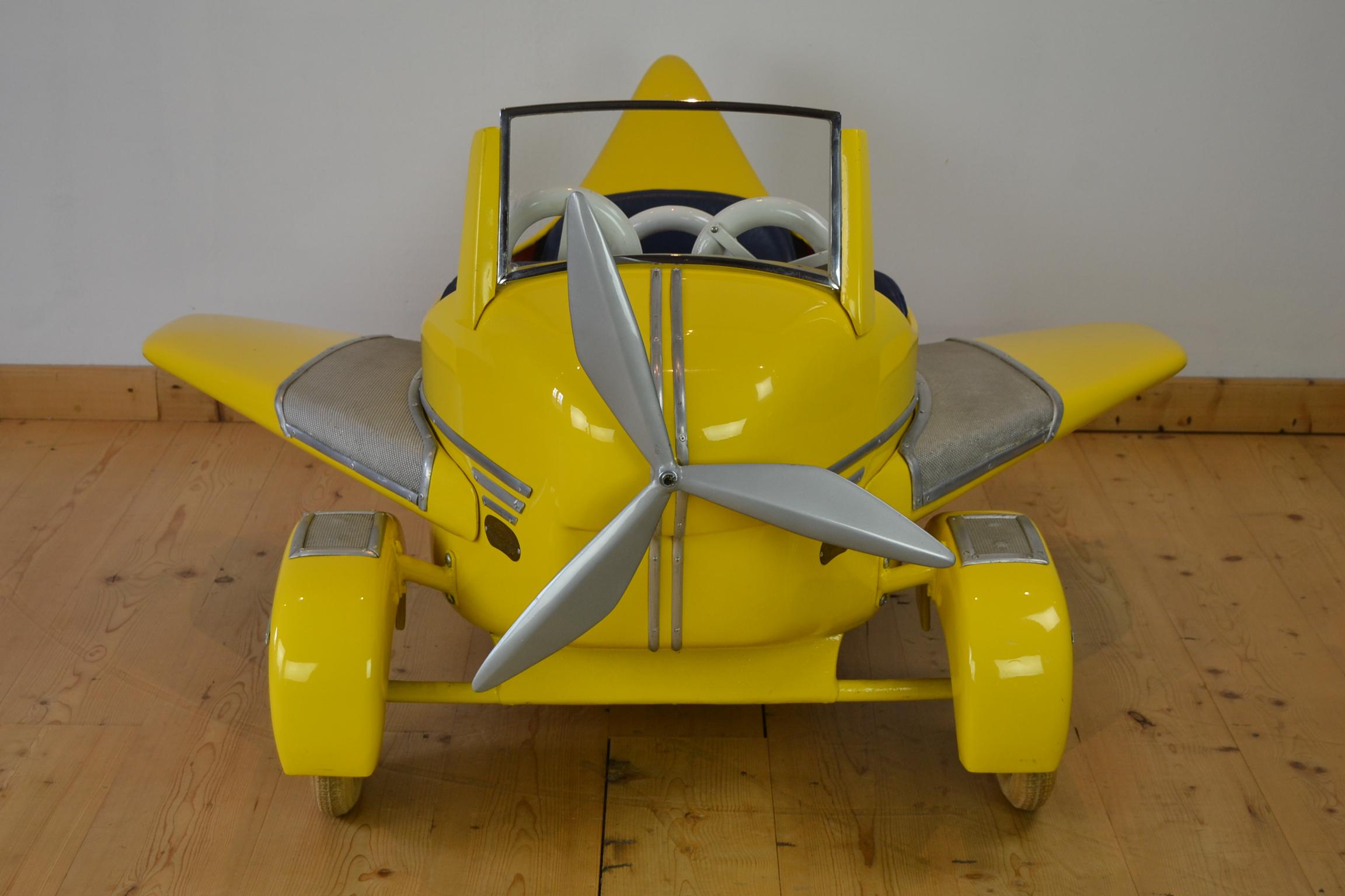 Great Carousel Airplane by L’ Autopède Belgium.
This carousel plane has the beautiful eye-catching color yellow. It’s a metal fairground aeroplane which was made in the 1950s by the Belgian Atelier L’Autopède - Autopede – L’Autopède which was