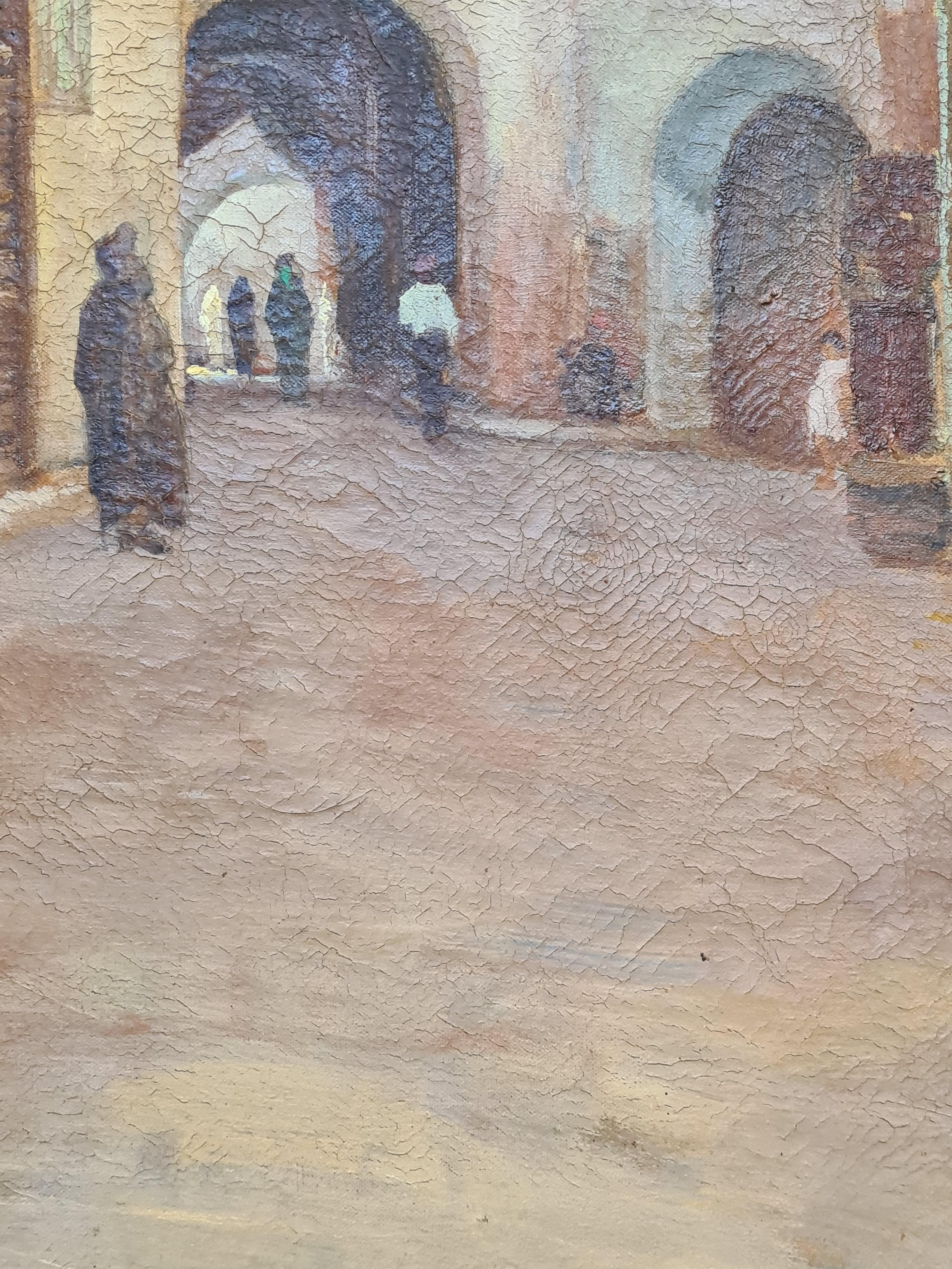 A late 19th century oil on canvas Orientalist street scene by L Bour. Signed and monogrammed bottom left.

A charming rendition of a street scene, the colourful buildings, carved wood doorways, a carpet seller sitting in front of his shop. Bour has