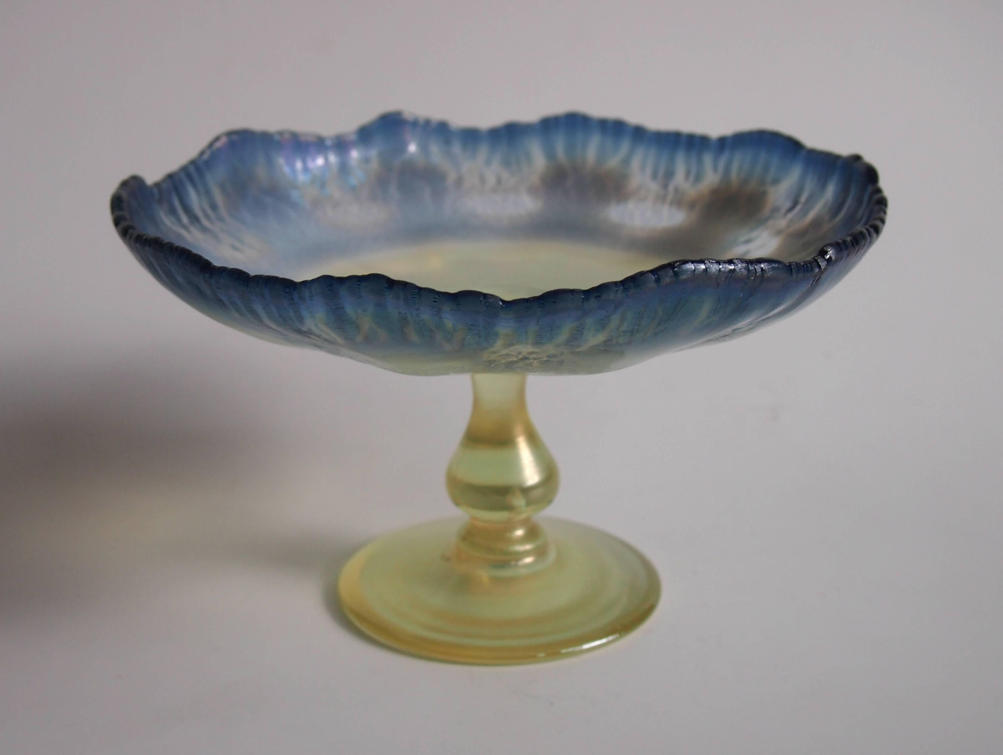 A very fine Louis comfort Tiffany blue and opal Pastel Favrile Compote/Tazza with a yellow knopped stem and foot. Beautifully signed 'L.C.Tiffany Favrile' -on the base. See picture 6. The blue edge is classic tiffany onion skin transitioning to the