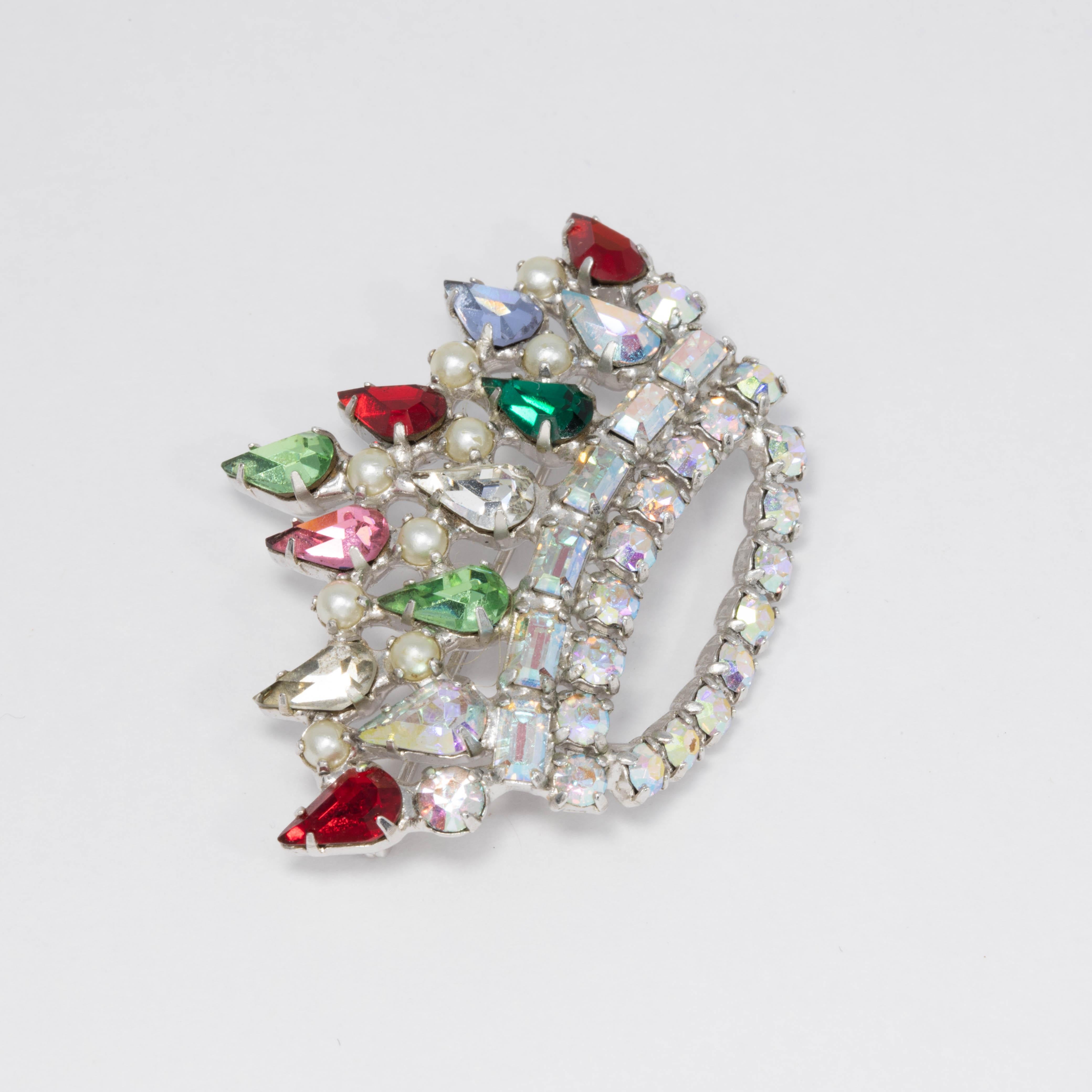 A luxurious crown fit for royalty! This silvertone pin brooch is decorated with clear, rose, ruby, emerald, and aurora borealis crystals & faux pearls for a truly regal look.

Signed L David
