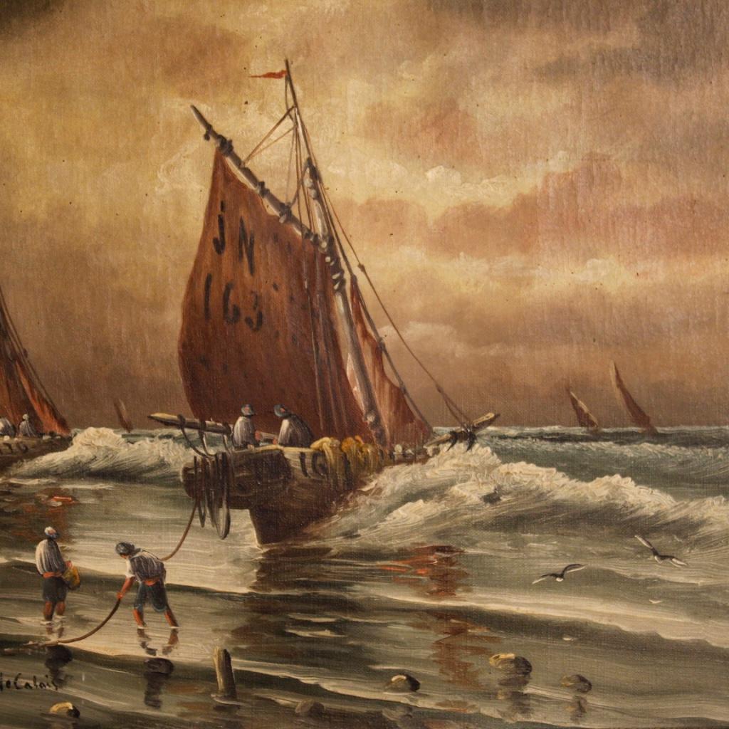 French painting from late 19th century. Oil painting on canvas depicting a seascape with boats and characters in Calais (see writing on the lower left) signed lower right (L. Henry). Framework of pleasant decor with carved wooden frame from 20th