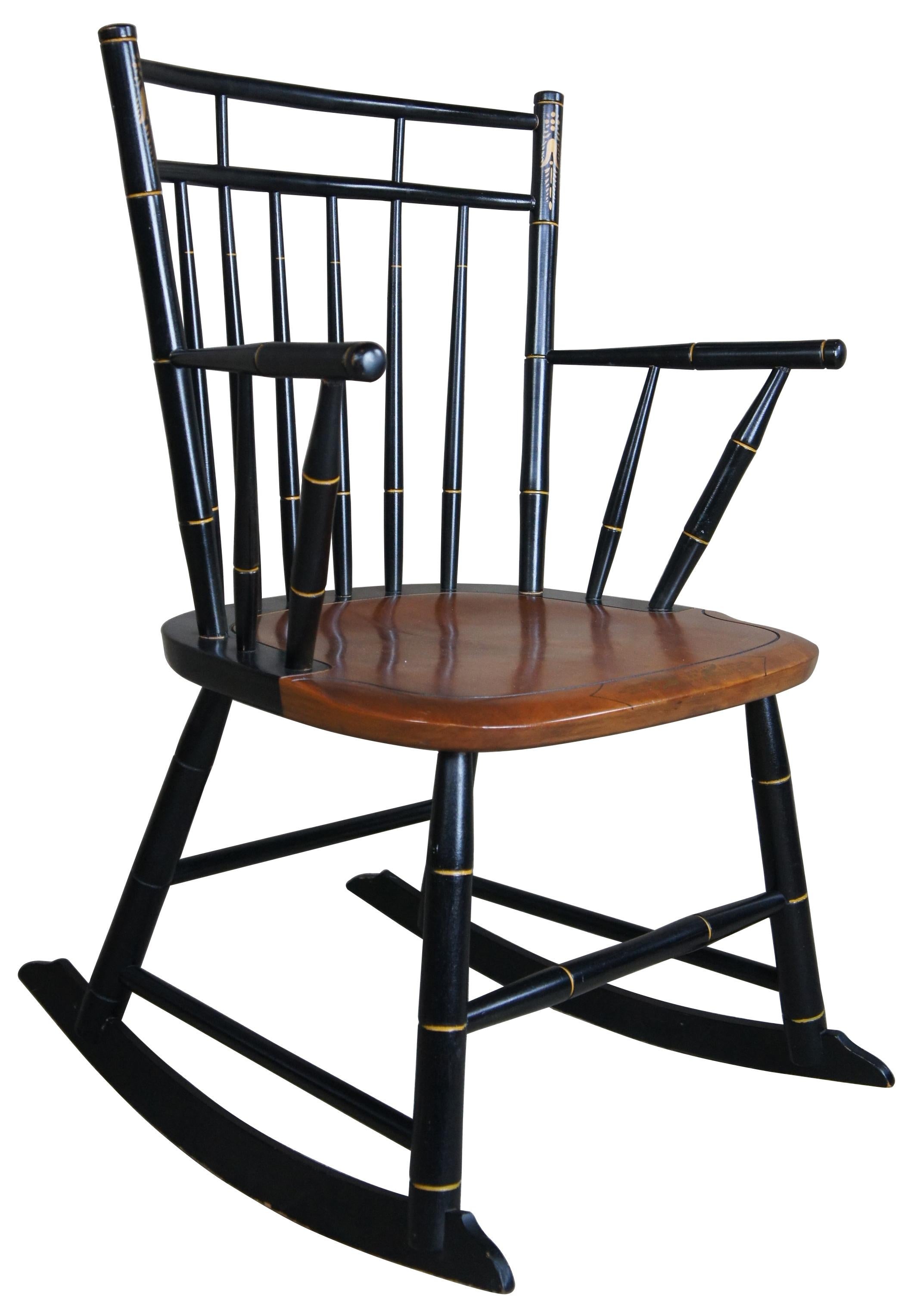 Vintage Hitchcock rocking chair or rocker. Features black ebonized and maple with stenciled slats. Made in Hitchcocksville Connecticut.
 