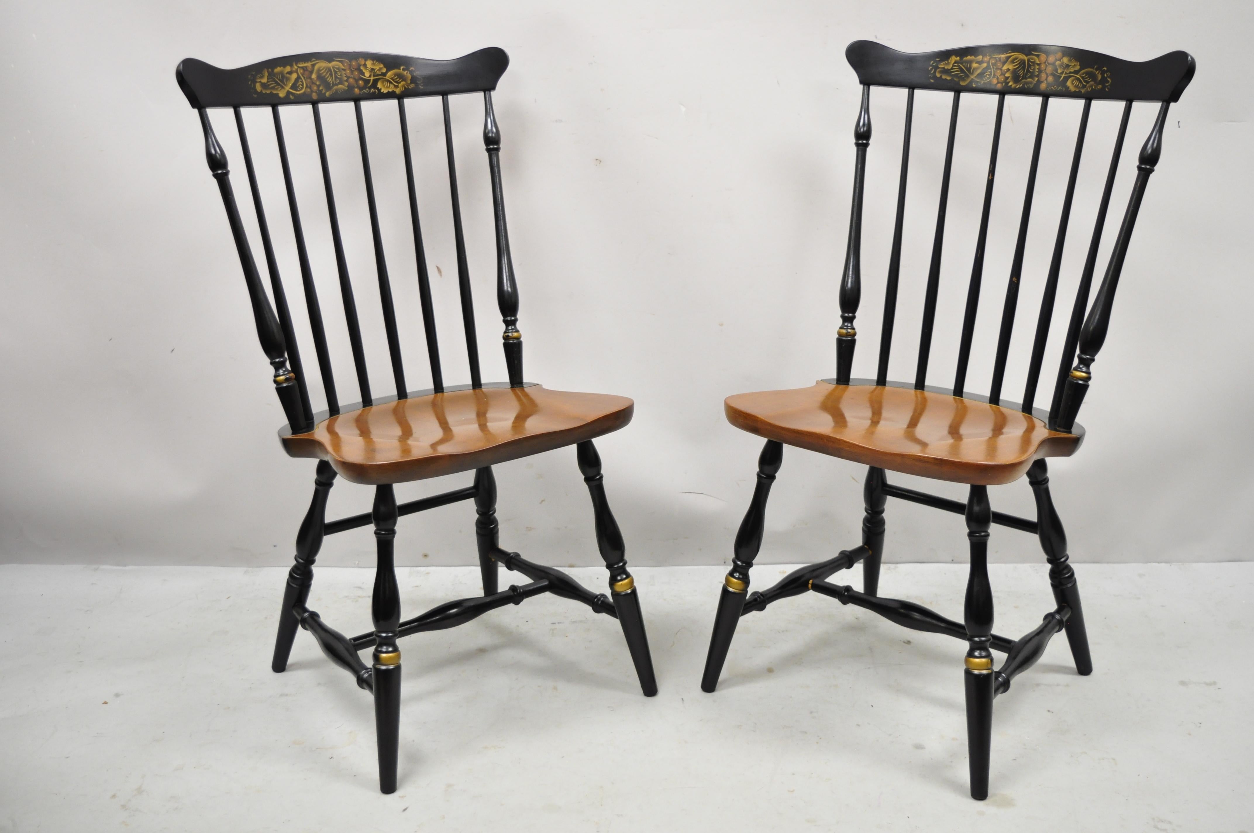 Vintage L. Hitchcock black stenciled Harvest painted maple Windsor dining chairs - a pair. Item features black ebonized finish, stencil painted harvest design, quality American craftsmanship. Circa mid-20th century. Measurements: 36
