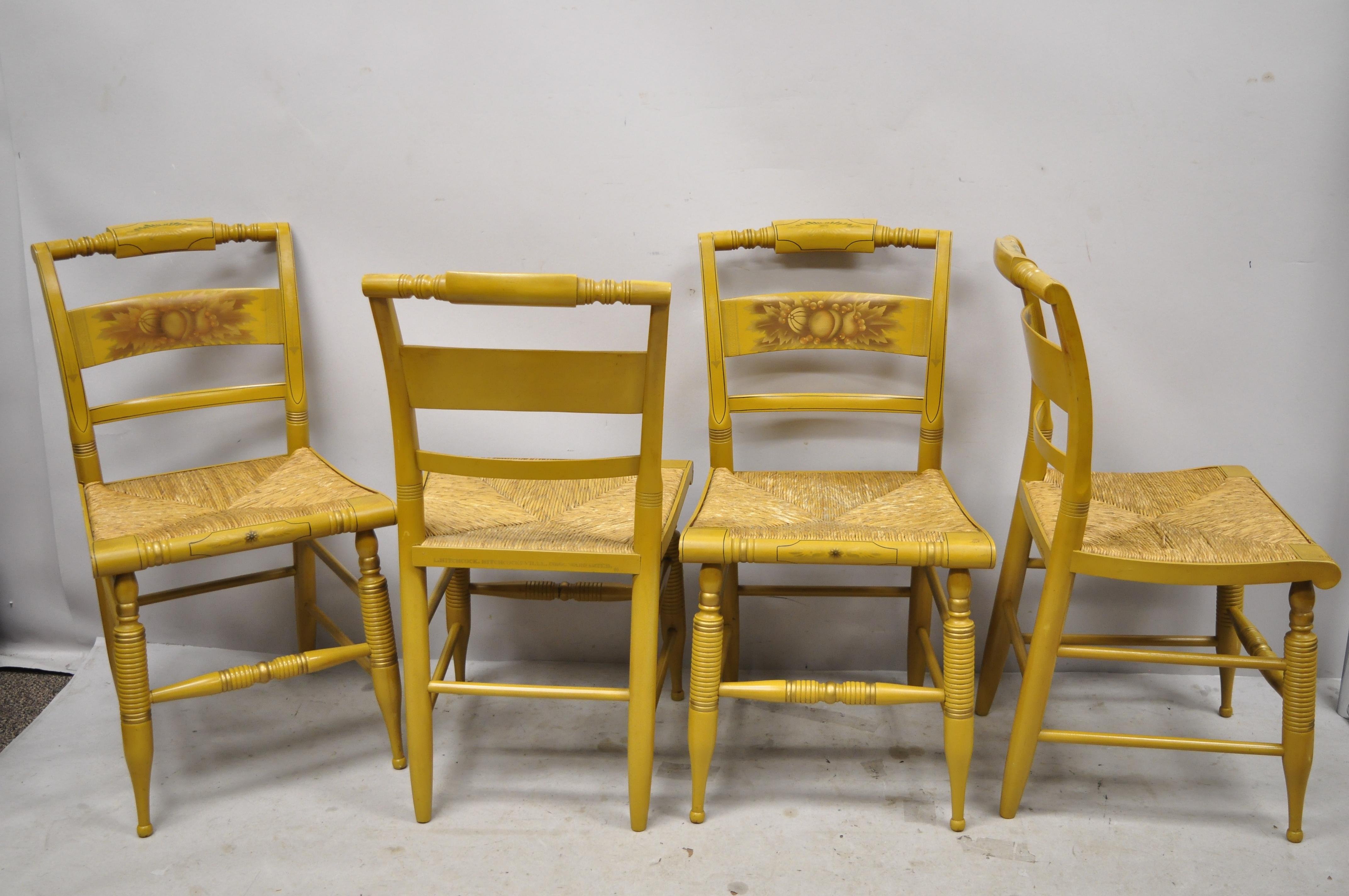 L. Hitchcock yellow stenciled rush seat dining side chairs - Set of 4. Item features yellow stencil painted details, woven rush cord seat, solid wood construction, original signature, very nice vintage item, quality American craftsmanship, circa mid