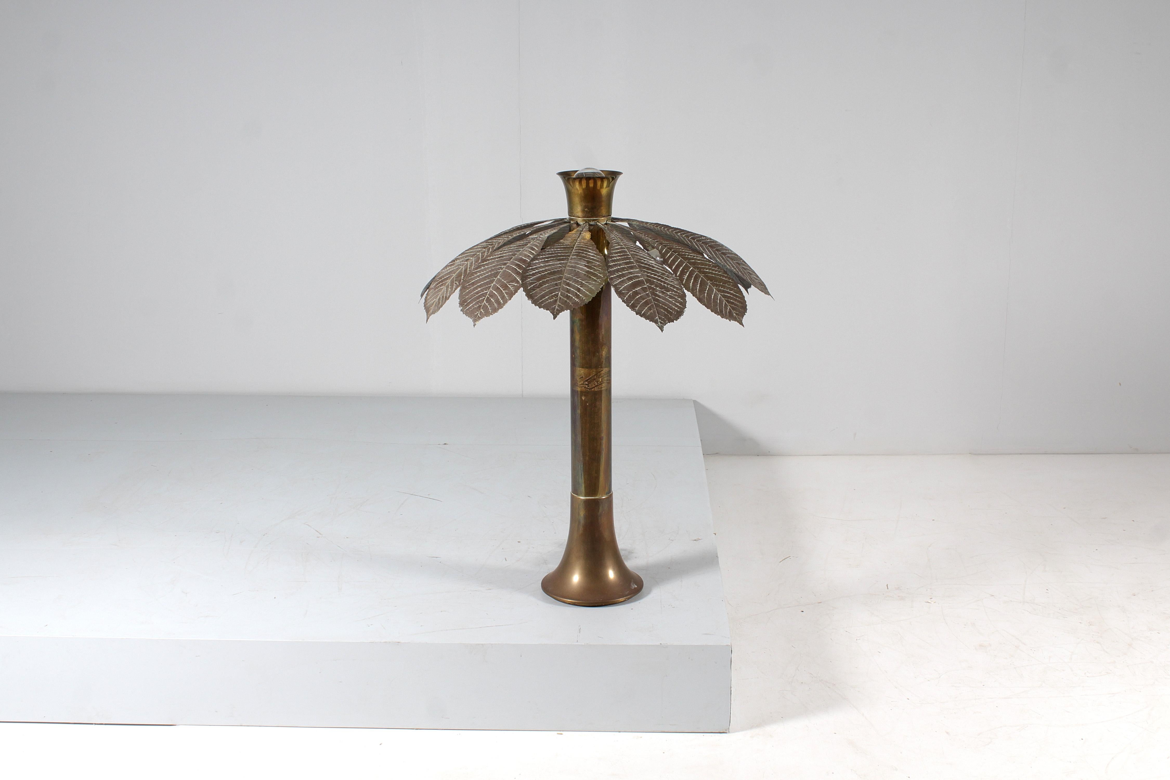 Table lamp mod. “L' Ippocastano” by Carlo Giorgi for Bottega Gadda Milano, Italy 1970s.
Brass structure, hand hammered twelve brass leaves inserted with screws around the lights. It works with 4 bulbs with an E14 screw connection and a central one,