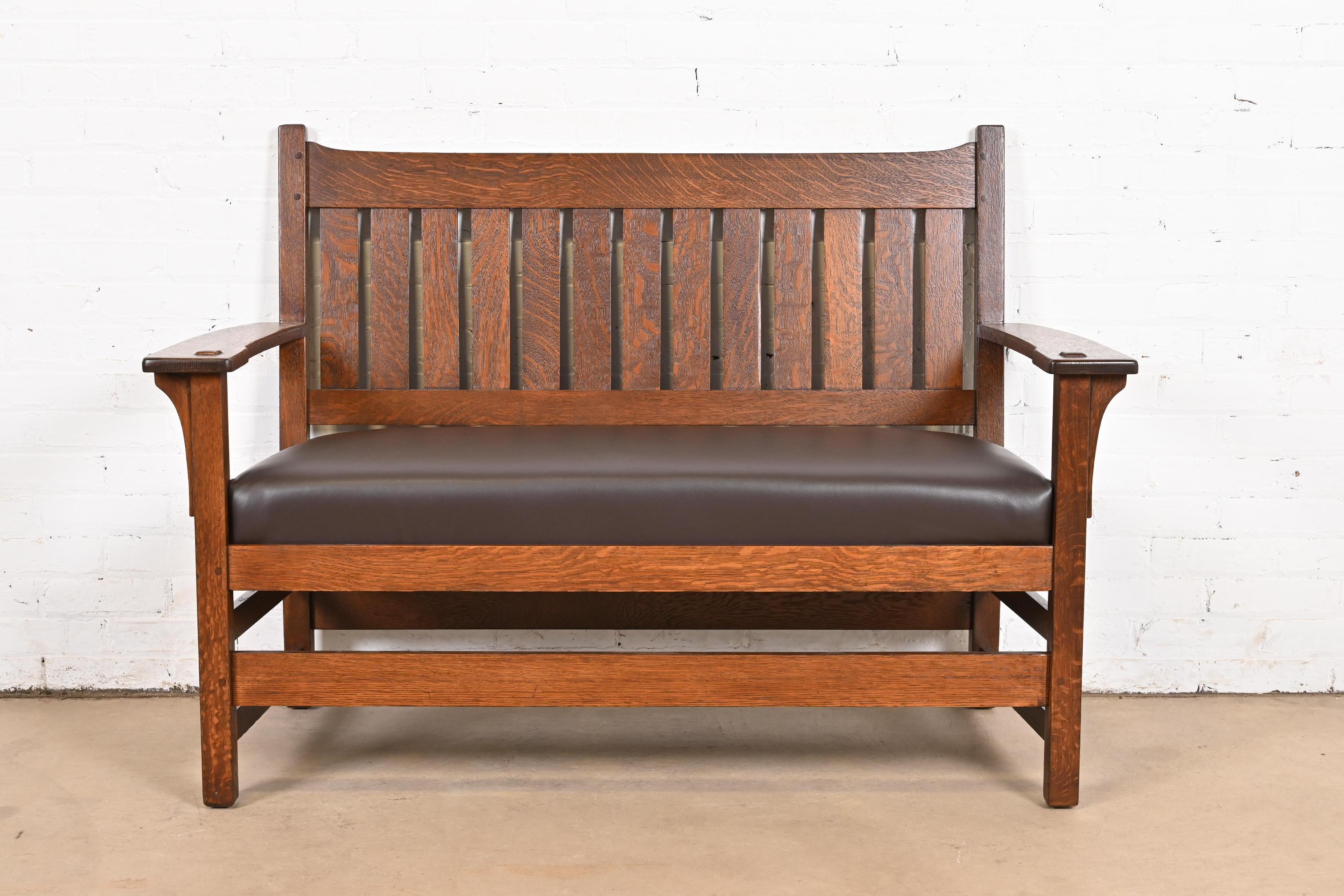A gorgeous antique Mission or Arts & Crafts period bench, settee, or love seat

By L. & J.G. Stickley

USA, Circa 1900

Solid quarter sawn oak, with leather upholstery.

Measures: 52.5