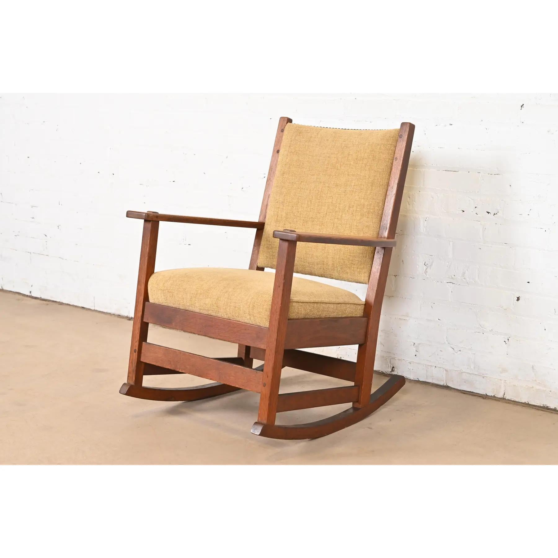 An exceptional antique Mission or Arts & Crafts period rocking chair

By L. & J.G. Stickley

USA, Circa 1900

Solid quarter sawn oak frame, with upholstered seat and back cushions.

Measures: 25.75