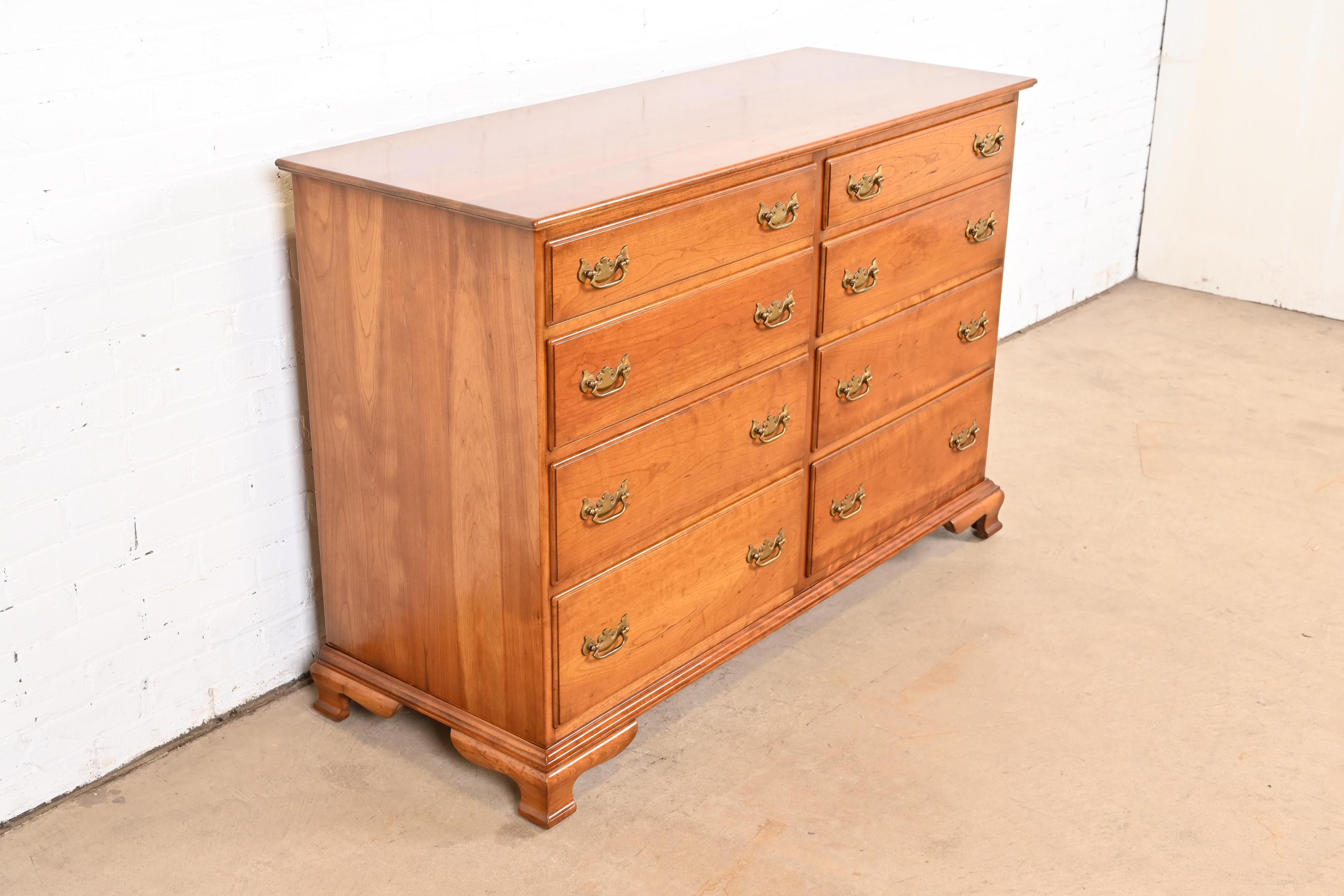 A gorgeous Georgian, American Chippendale, or Colonial style eight-drawer double dresser

By L. & J.G. Stickley

USA, 1950s

Solid cherry wood, with original brass hardware.

Measures: 52.25